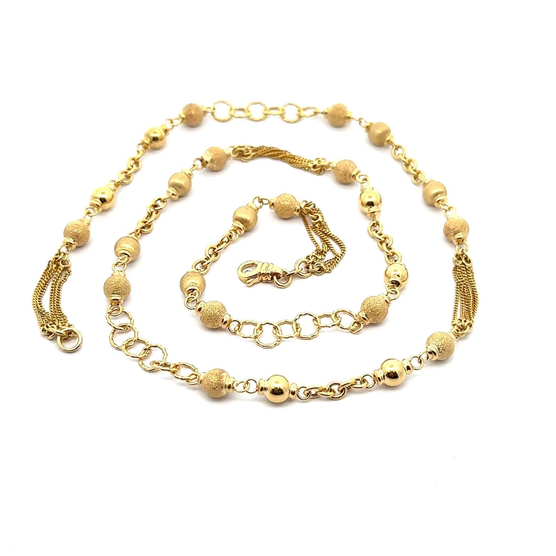 Unique 14k Gold 24 Inch Multi Chain Curb Link Necklace: Unique 14k Gold 24 Inch Multi Chain Curb Link Necklace This stunning necklace features a unique design with textured beads and multi curb link sections, crafted from solid 14k yellow gold. With a leng
