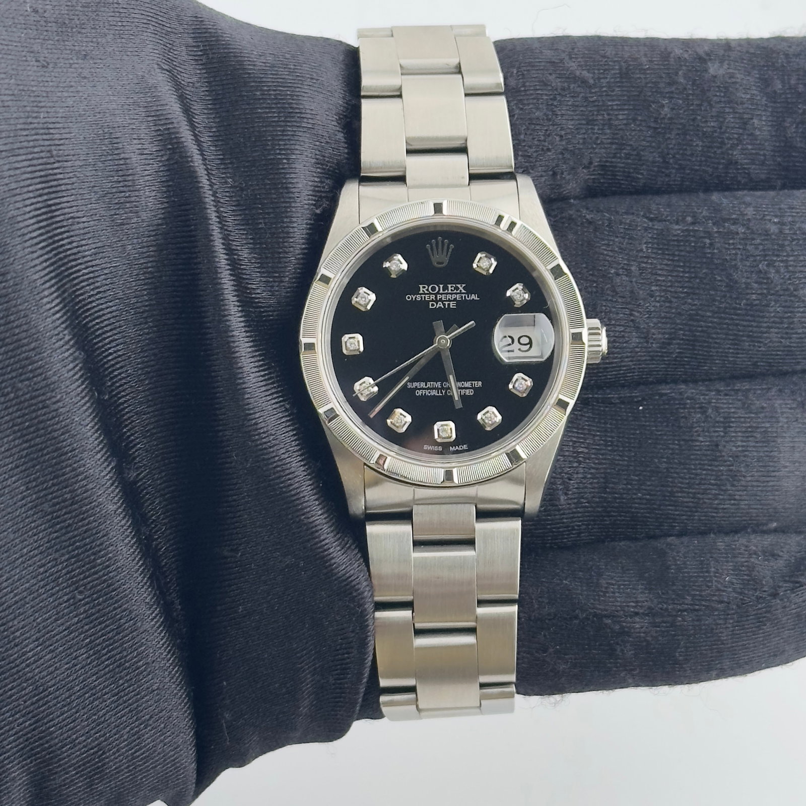 Rolex Oyster Perpetual Date 15210 Watch Aftermarket Black Diamond Dial Papers 1994: Rolex Oyster Perpetual Date 15210 Watch Aftermarket Black Diamond Dial Papers 1994 This Rolex Oyster Perpetual Date features an aftermarket black diamond dial, engine-turned bezel, and classic Oyster 