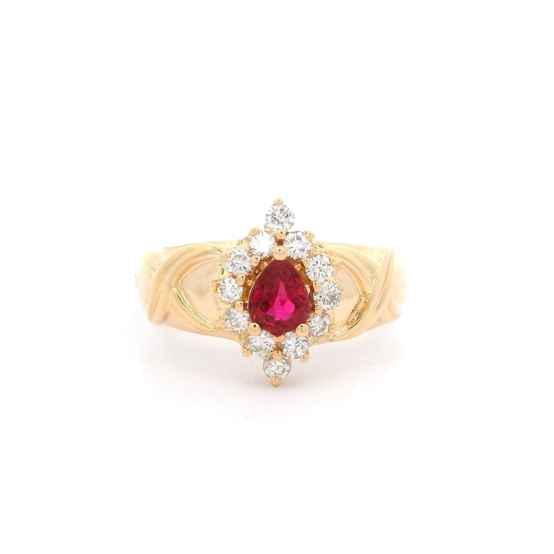 14k Yellow Gold Ruby Diamond Halo Band Ring 0.74ctw: 14k Yellow Gold Ruby Diamond Halo Band Ring 0.74ctw This stunning cocktail ring features a captivating design with a vibrant pear-shaped ruby at its center, surrounded by a halo of sparkling diamonds.