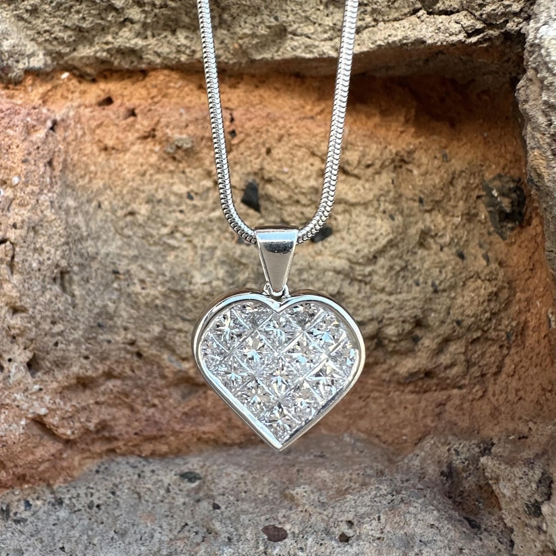 Platinum Heart Pendant Necklace with 2.50ctw Invisible Set Diamonds 16 Inch: Platinum Heart Pendant Necklace with 2.50ctw Invisible Set Diamonds 16 Inch This women's necklace features a snake link chain crafted from solid platinum, paired with a heart-shaped pendant set with a