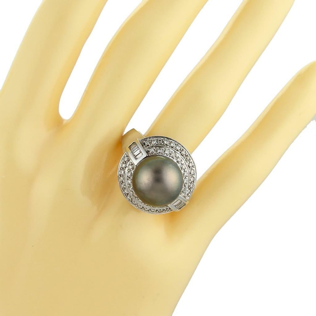 18k White Gold South Sea Pearl Diamond Ring 12mm: 18k White Gold South Sea Pearl Diamond Ring 12mm This elegant ring features a large 12mm dark grey South Sea pearl set atop a distinctive double-tiered skirt design crafted from 18k white gold. The sk