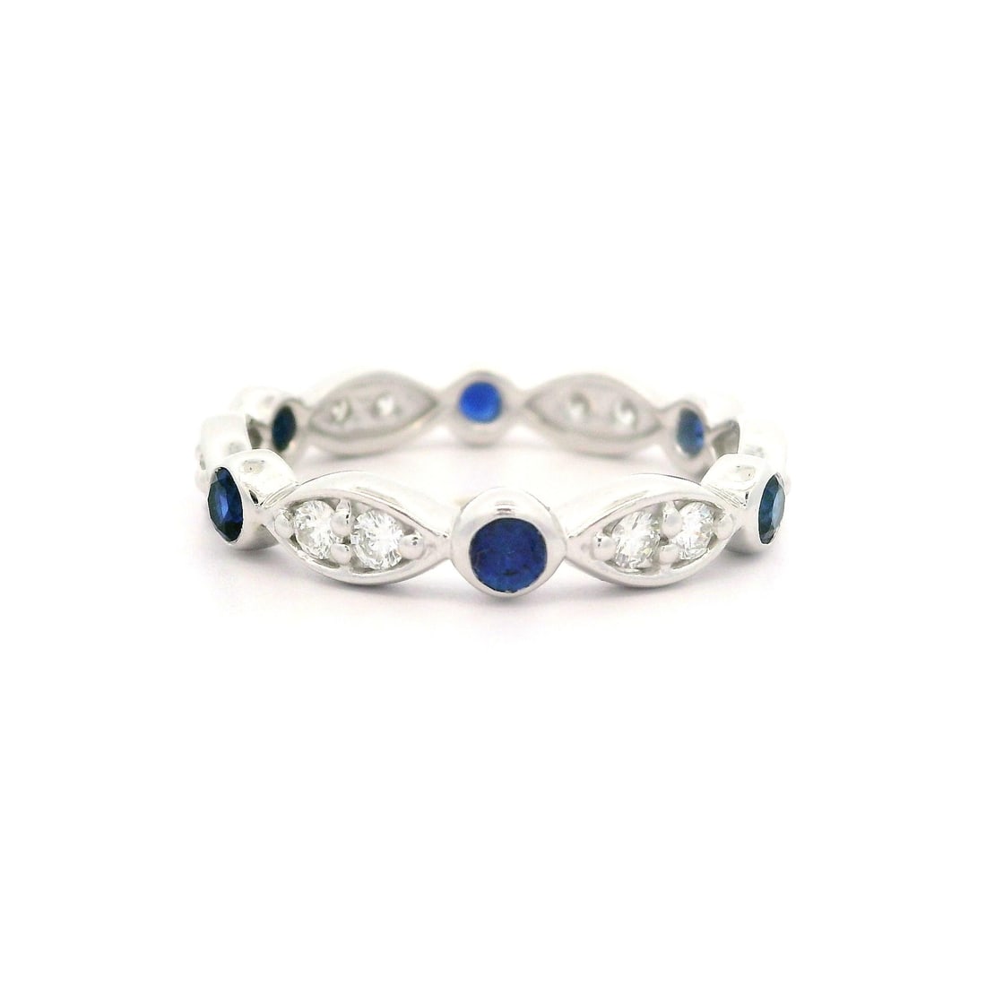 14k White Gold 0.90ctw Sapphire and Diamond Eternity Band Ring: 14k White Gold 0.90ctw Sapphire and Diamond Eternity Band Ring This stunning 14k white gold eternity band ring features a captivating arrangement of natural sapphires and diamonds, making it an except