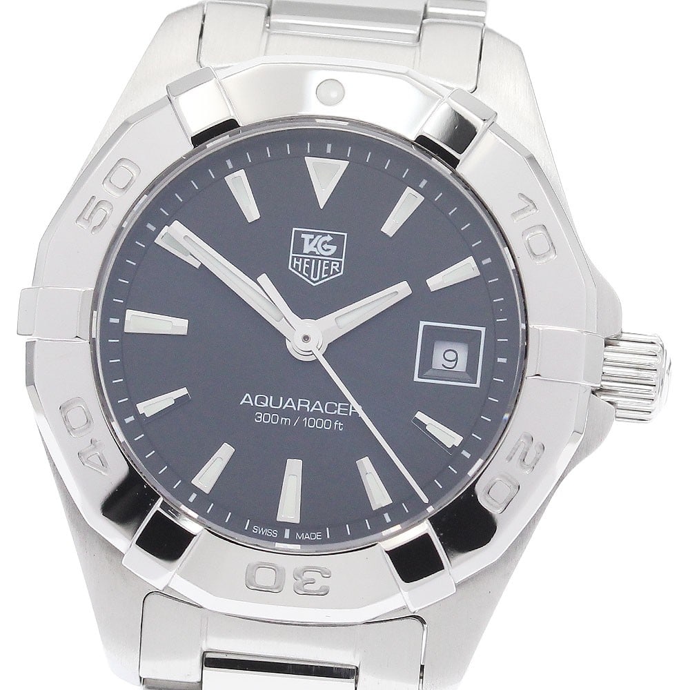 TAG Heuer Aquaracer women's quartz date watch WAY1410: TAG Heuer Aquaracer women's quartz date watch WAY1410 This TAG Heuer Aquaracer Date Quartz women's wristwatch features a stainless steel case and band, paired with a black dial for a classic, versatil