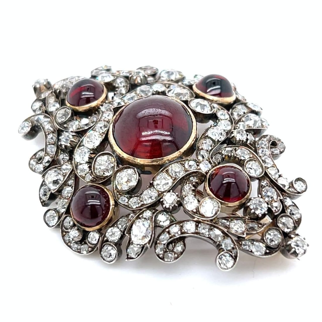 Victorian 14K Gold Silver Top Diamond Garnet Brooch 2.25 inches: Victorian 14K Gold Silver Top Diamond Garnet Brooch 2.25 inches This exquisite Victorian brooch combines the elegance of 14K gold with a silver top, showcasing a stunning arrangement of 5 garnets and 