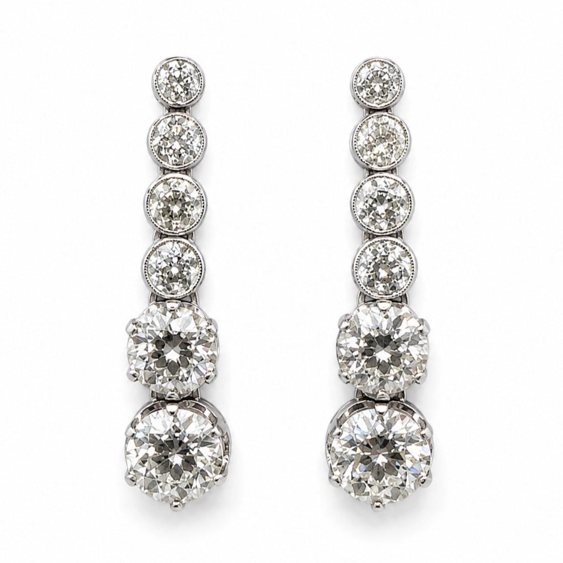 Platinum Art Deco Diamond Drop Earrings 8.40 Ct: Platinum Art Deco Diamond Drop Earrings 8.40 Ct These Art Deco earrings are crafted in platinum and feature a total diamond weight of approximately 8.40 carats. The earrings are set with two European-