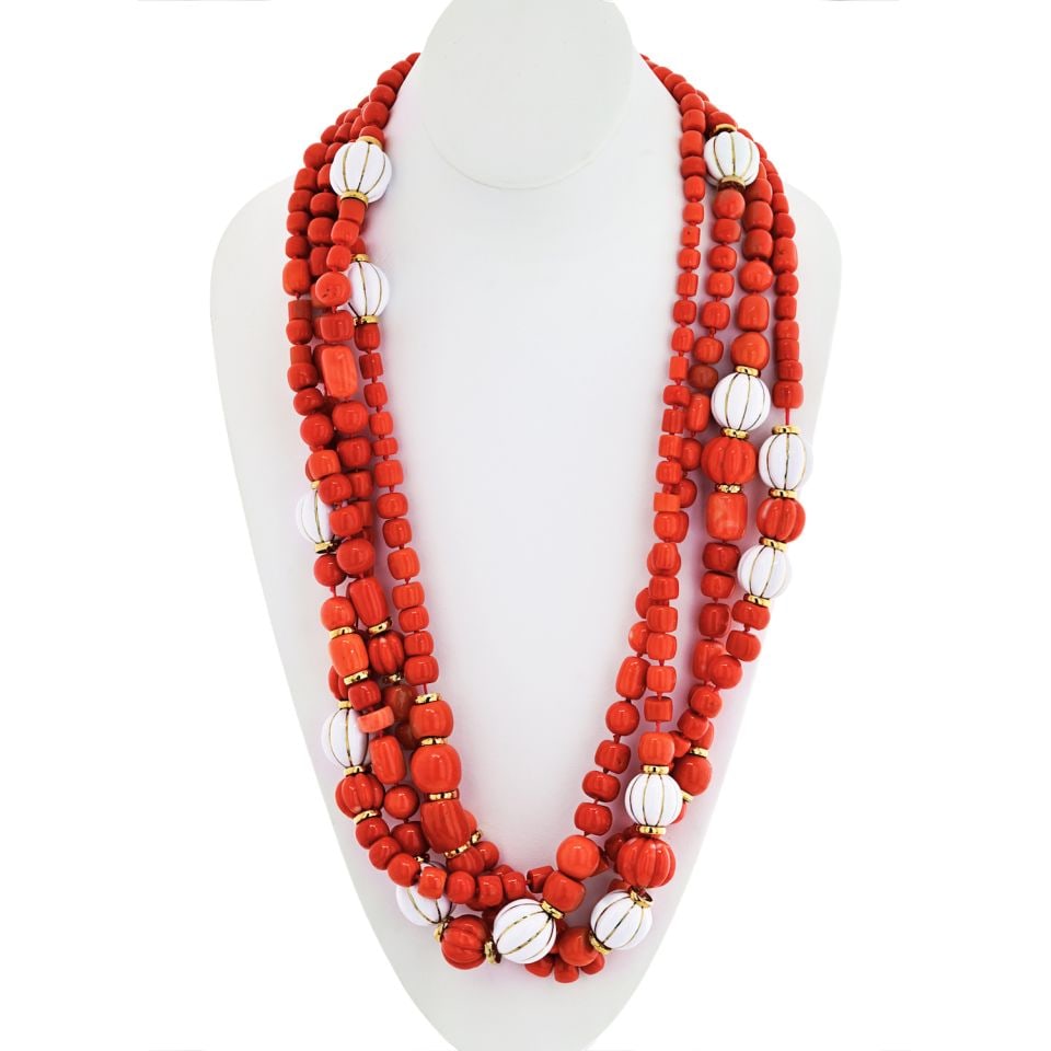 David Webb 18K Yellow Gold Multi-Strand Coral Enamel Necklace 31 Inches: David Webb 18K Yellow Gold Multi-Strand Coral Enamel Necklace 31 Inches This exquisite multi-strand necklace showcases a stunning combination of natural carved coral and white enamel, crafted in luxur
