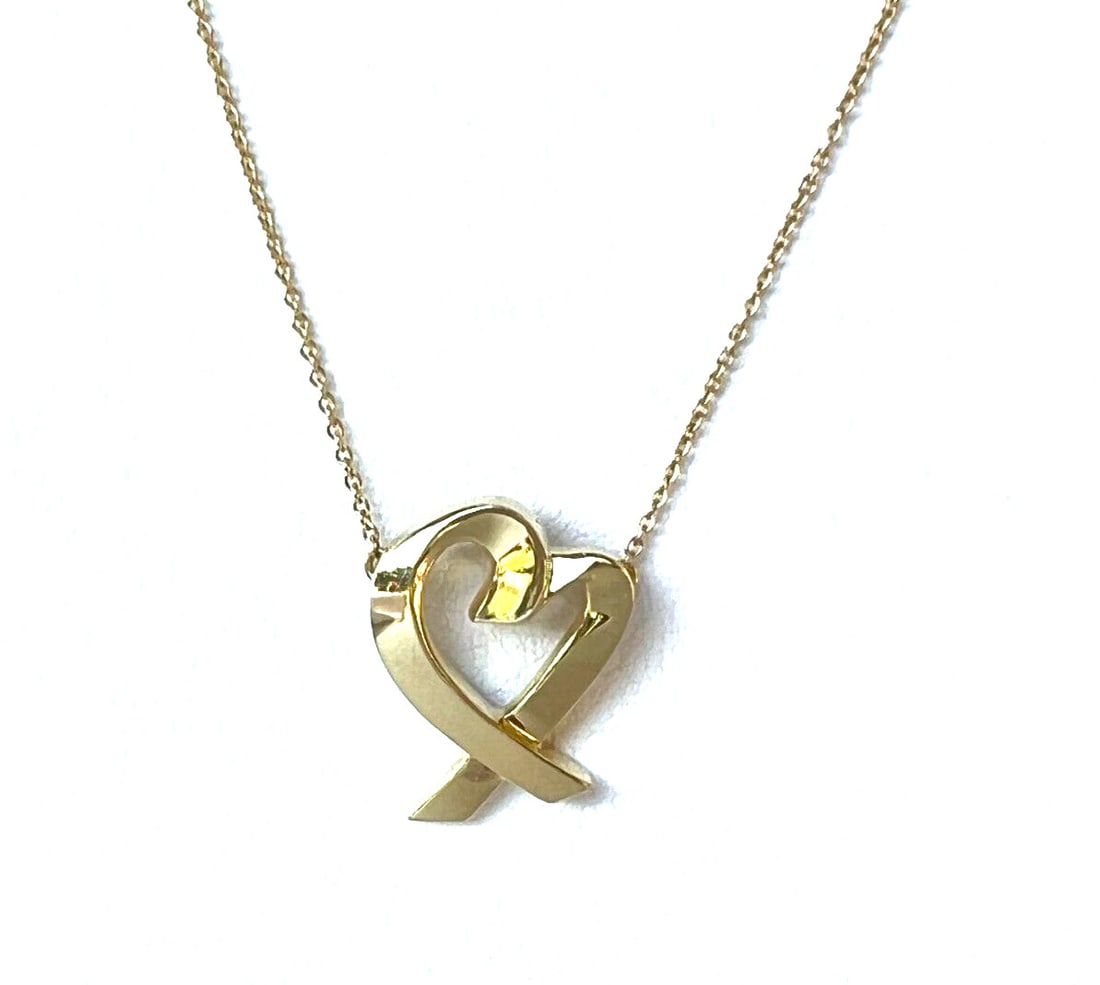 Paloma Picasso 18K Gold Heart Pendant Necklace Tiffany & Co: Paloma Picasso 18K Gold Heart Pendant Necklace Tiffany & Co This exquisite Paloma Picasso heart pendant necklace is crafted from 18K yellow gold and designed for Tiffany & Co. The elegant pendant meas