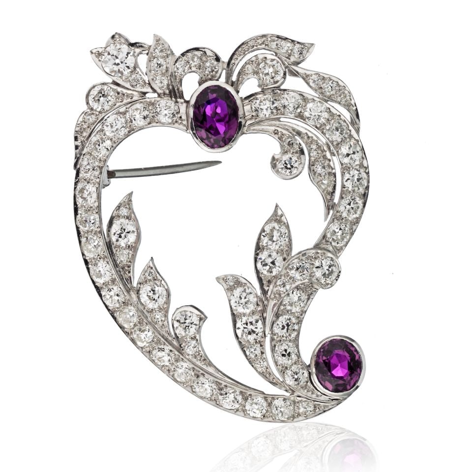 Edwardian Platinum Brooch with 2 Rubies and 7 Carats Old Cut Diamonds: Edwardian Platinum Brooch with 2 Rubies and 7 Carats Old Cut Diamonds This exquisite Edwardian brooch is a stunning piece crafted in platinum, showcasing the elegance of old cut diamonds complemented 