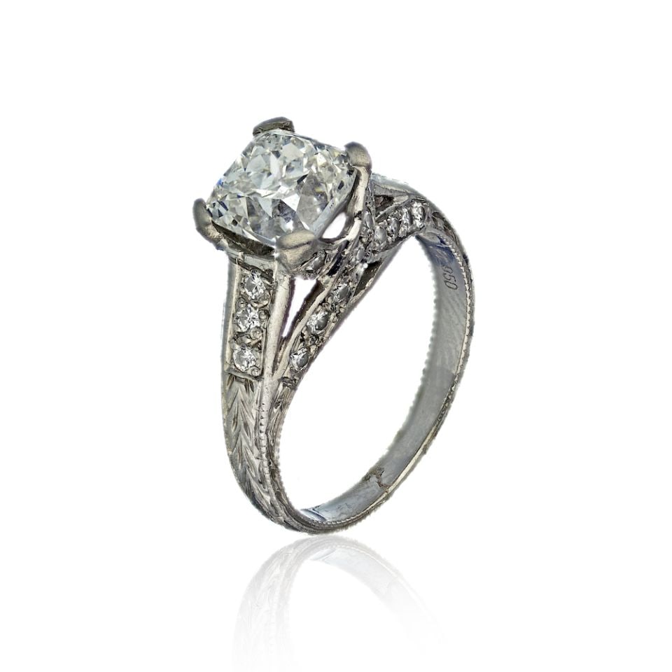 Platinum Engagement Ring 2.01 Cts with 12 Diamonds Size 6.5: Platinum Engagement Ring 2.01 Cts with 12 Diamonds Size 6.5 This exquisite ring is crafted from high-quality platinum, weighing 4.4 grams. It features a stunning total diamond weight of 2.01 carats, e