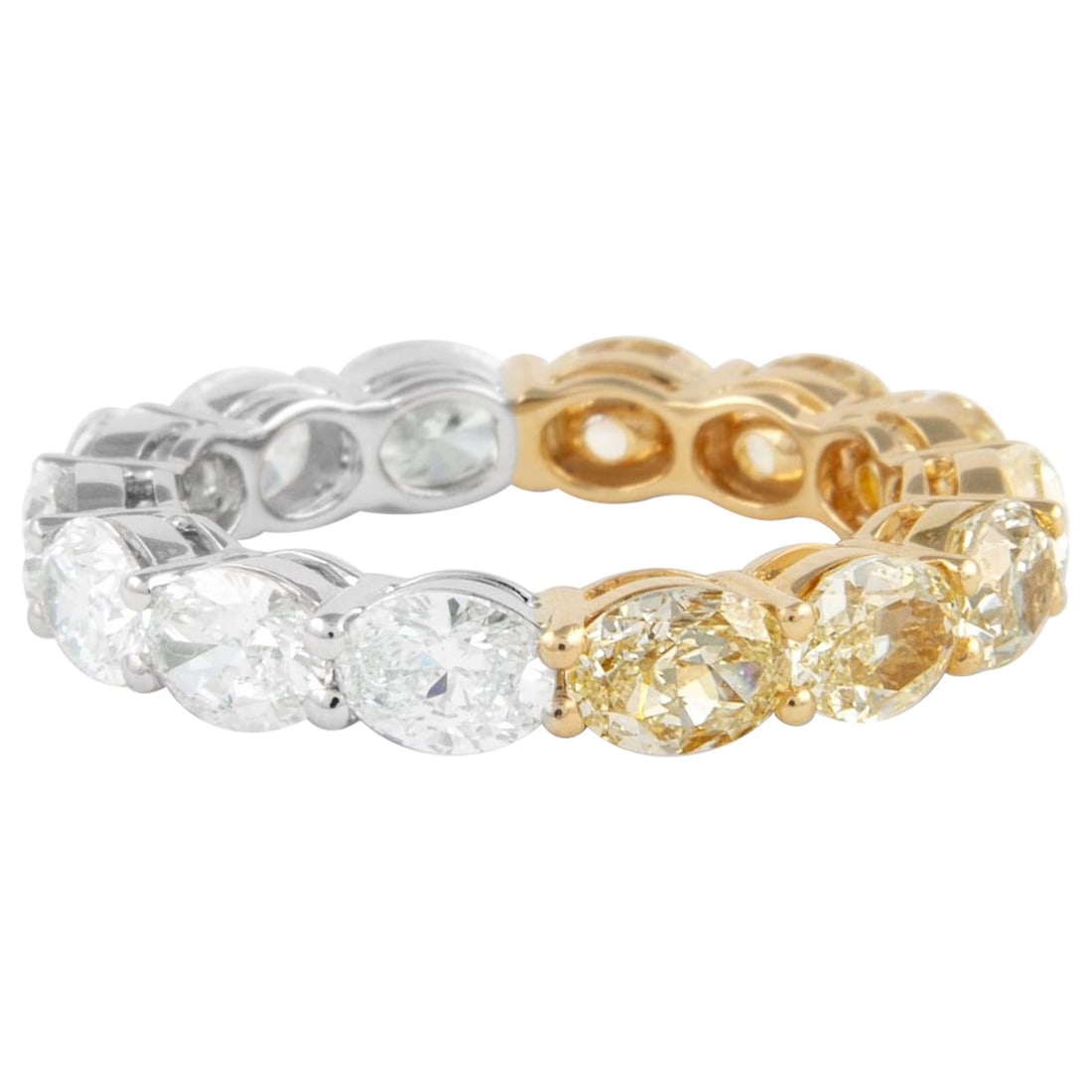 5.09ct Oval Yellow White Diamond Eternity Band 18k Gold: 5.09ct Oval Yellow White Diamond Eternity Band 18k Gold This exquisite eternity band features a stunning design with oval cut yellow and white diamonds, totaling 5.09 carats. The ring is crafted in a 