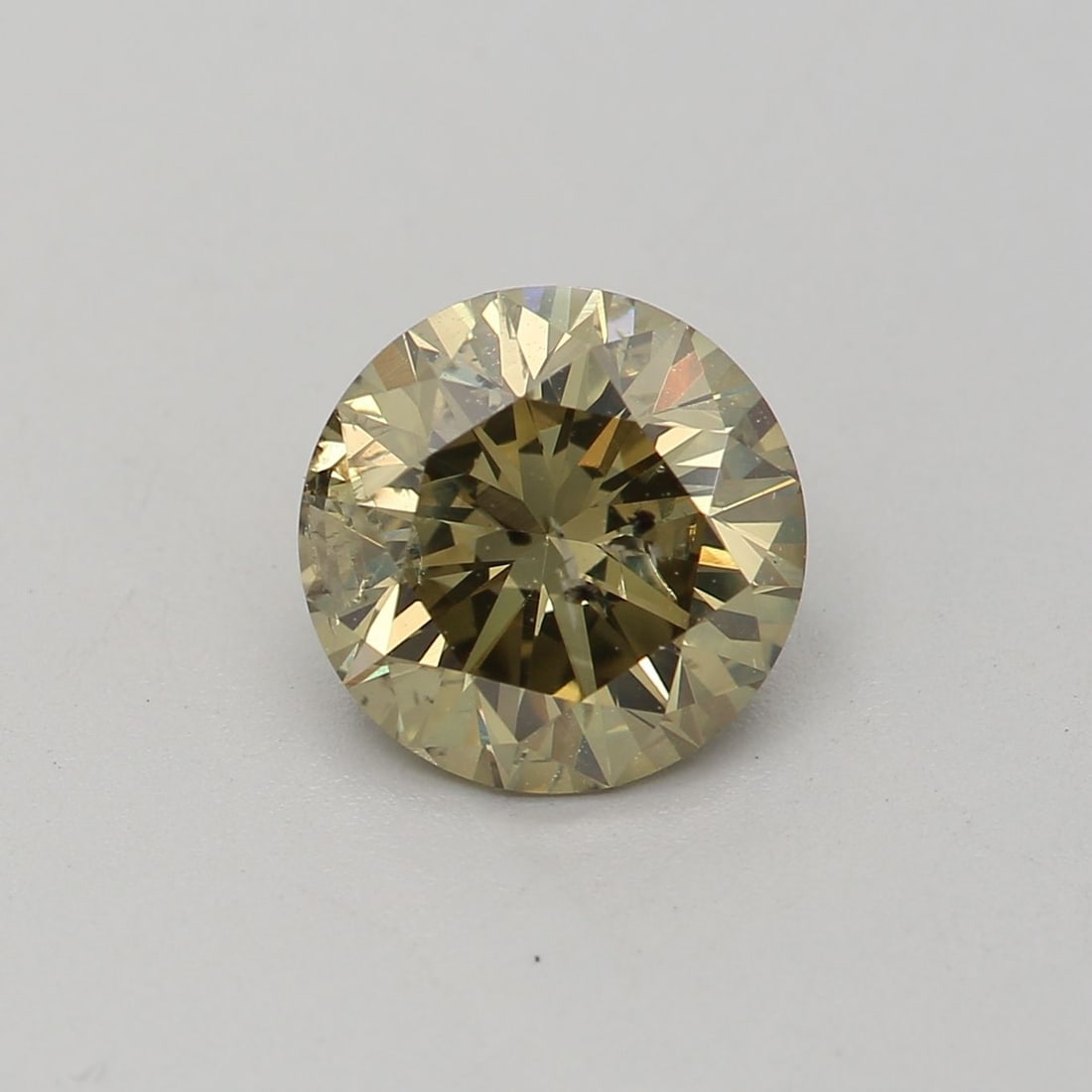 Loose Diamond - ROUND 1.03ct Fancy Dark Brown Greenish Yellow I2: Loose Diamond - ROUND 1.03ct Fancy Dark Brown Greenish Yellow I2 Source: Natural Shape: ROUND Carats: 1.03 Color: Fancy Dark Brown Greenish Yellow Certification: GIA Video: