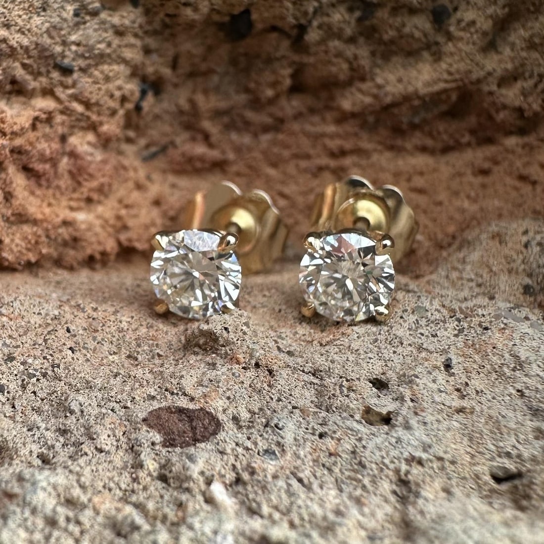 Pair of 14k Yellow Gold Diamond Stud Earrings 0.69ctw Four Prong Setting: Pair of 14k Yellow Gold Diamond Stud Earrings 0.69ctw Four Prong Setting These un-used stud earrings feature two natural round brilliant cut diamonds with a total weight of 0.69 carats, graded H/I col