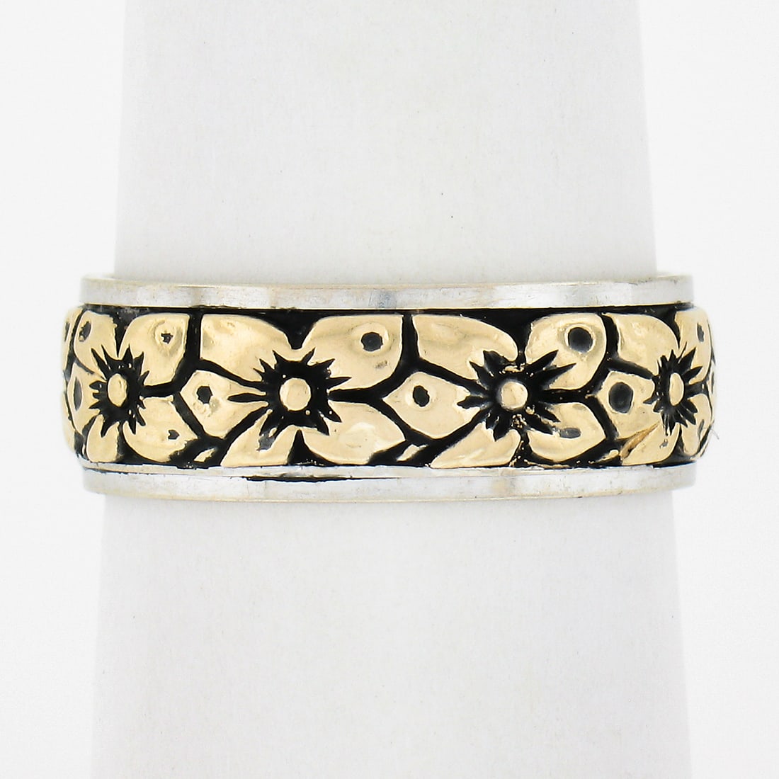 Vintage 14k Two Tone Floral Engraved 6.4mm Wide Band Ring: Vintage 14k Two Tone Floral Engraved 6.4mm Wide Band Ring This exquisite vintage 14k two-tone blackened gold ring features a beautifully engraved floral design, making it a perfect accessory for any s