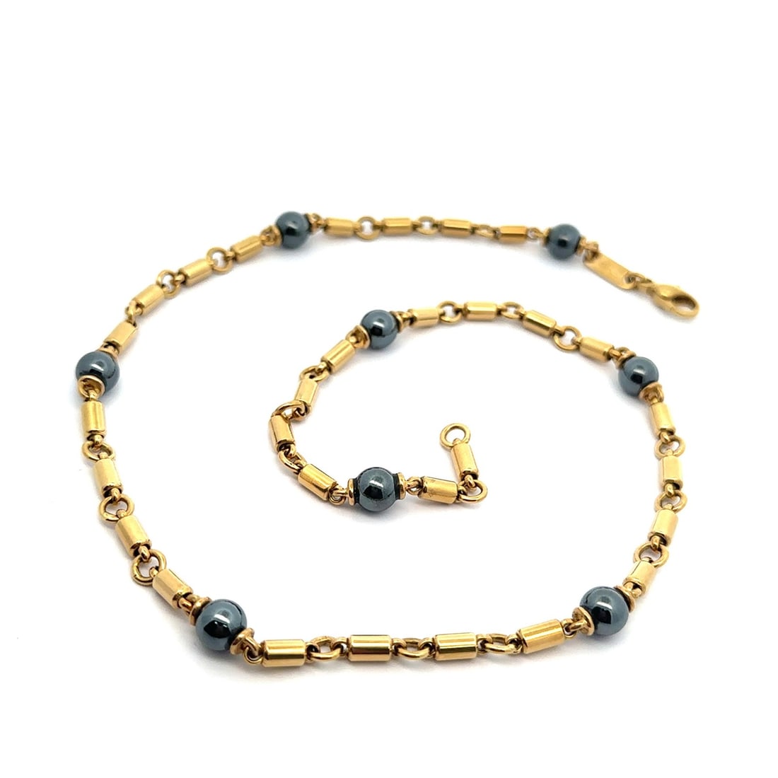 Italian 18k Yellow Gold Necklace With Hematite Beads Vintage Cylinder Tube Links: Italian 18k Yellow Gold Necklace With Hematite Beads Vintage Cylinder Tube Links This vintage Italian necklace features cylinder tube links crafted from 18k solid yellow gold, accented with eight natu