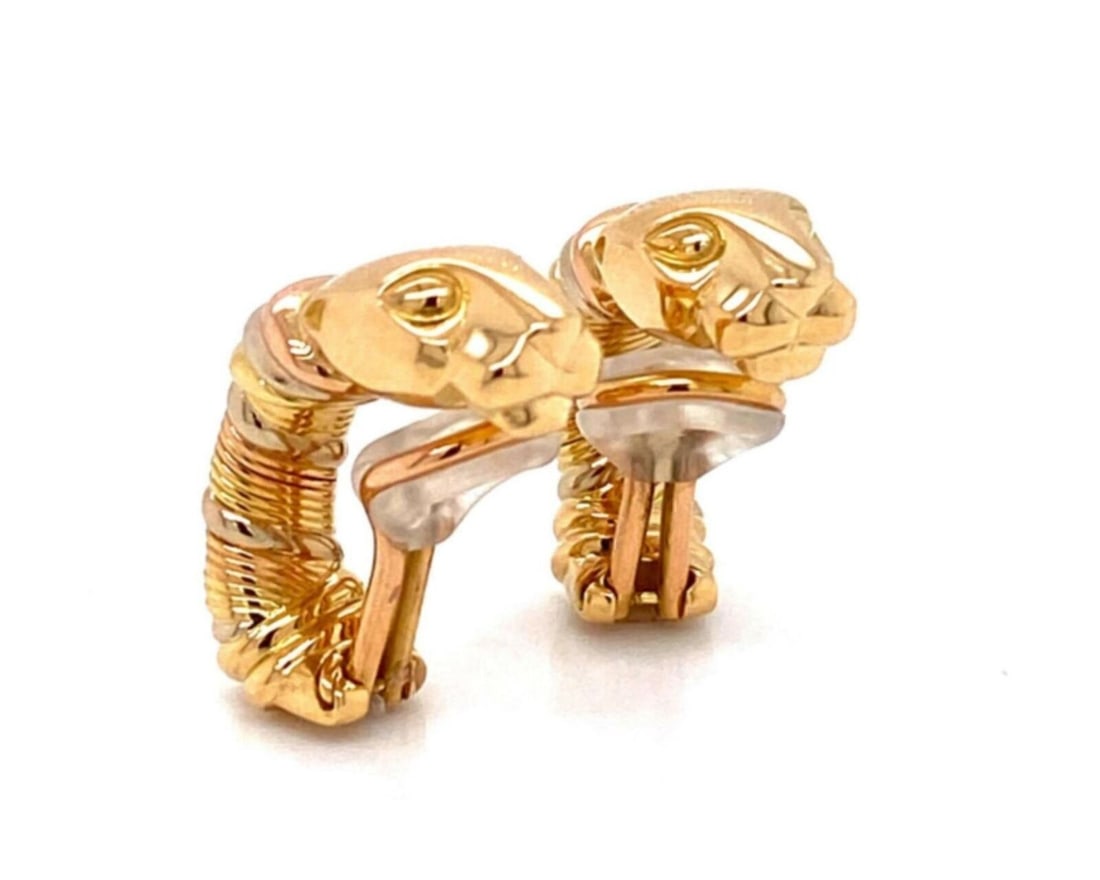 Cartier Panthere Clip-On Huggie Earrings 18k Tricolor Gold Pair: Cartier Panthere Clip-On Huggie Earrings 18k Tricolor Gold Pair Cartier Panthere clip-on huggie earrings crafted in 18k tricolor gold, featuring a sculpted panther head design with wire detail. The ea