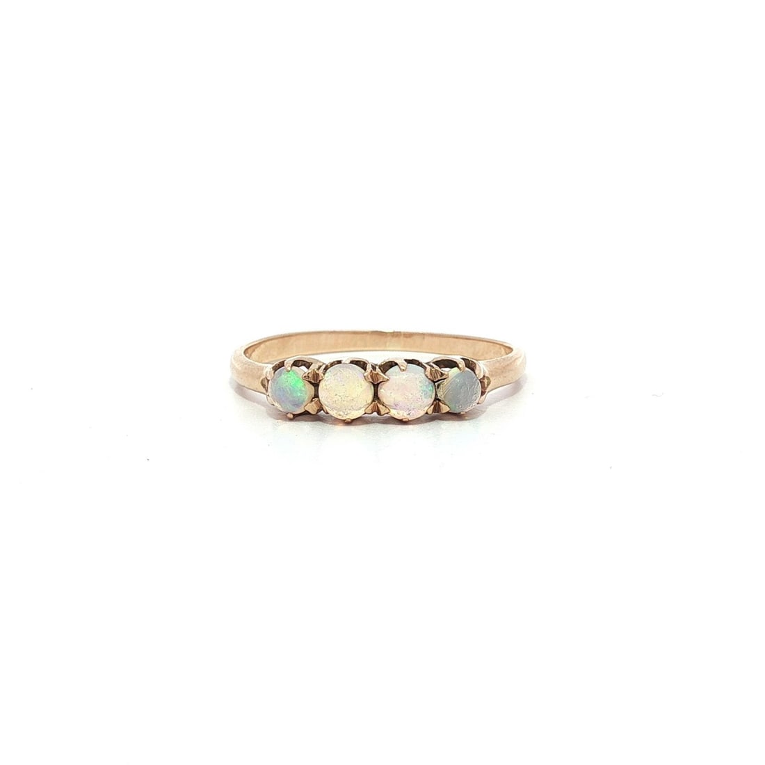 Antique Victorian 10k Yellow Gold Opal Cocktail Ring 4 Stone: Antique Victorian 10k Yellow Gold Opal Cocktail Ring 4 Stone This exquisite Antique Victorian band ring features a stunning arrangement of four natural genuine opals, each showcasing a captivating pla