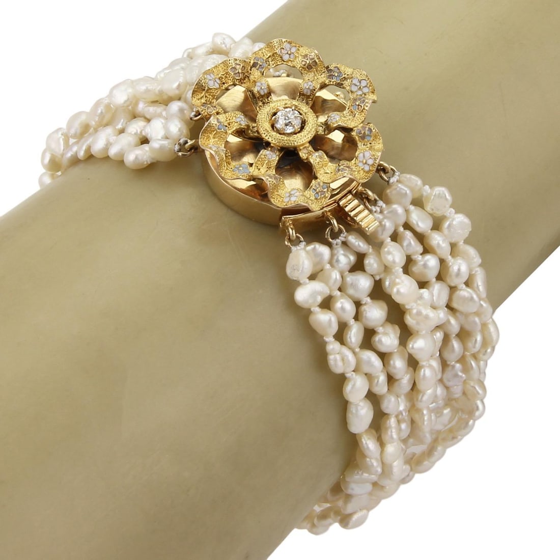 Vintage Art Nouveau 14k Gold Diamond Pearl Bracelet with Enamel Clasp: Vintage Art Nouveau 14k Gold Diamond Pearl Bracelet with Enamel Clasp Discover this exquisite vintage Art Nouveau bracelet featuring eight strands of lustrous freshwater pearls. The bracelet is anchor