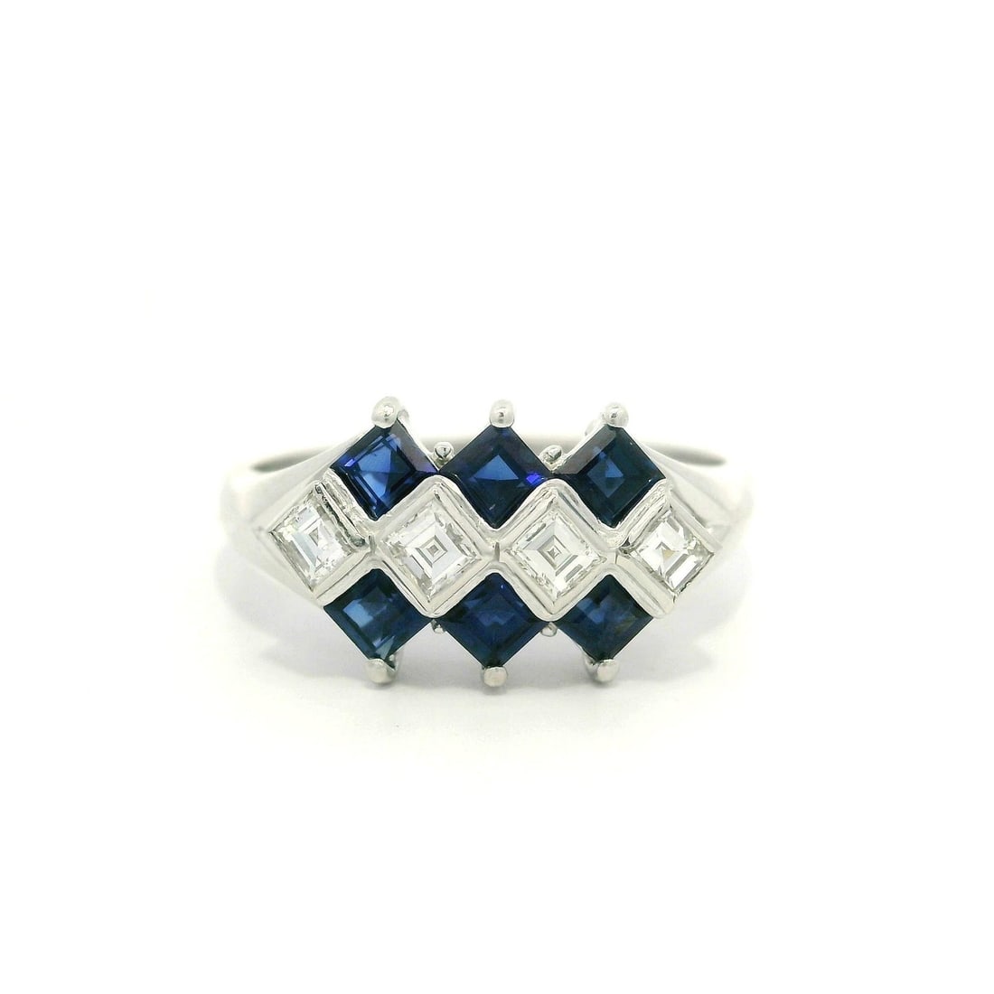 Platinum Geometric Ring 1.19ctw Blue Sapphire Diamond VS2: Platinum Geometric Ring 1.19ctw Blue Sapphire Diamond VS2 This exquisite ring showcases a stunning geometric design, featuring a captivating square step cut sapphire at its center. The natural royal b