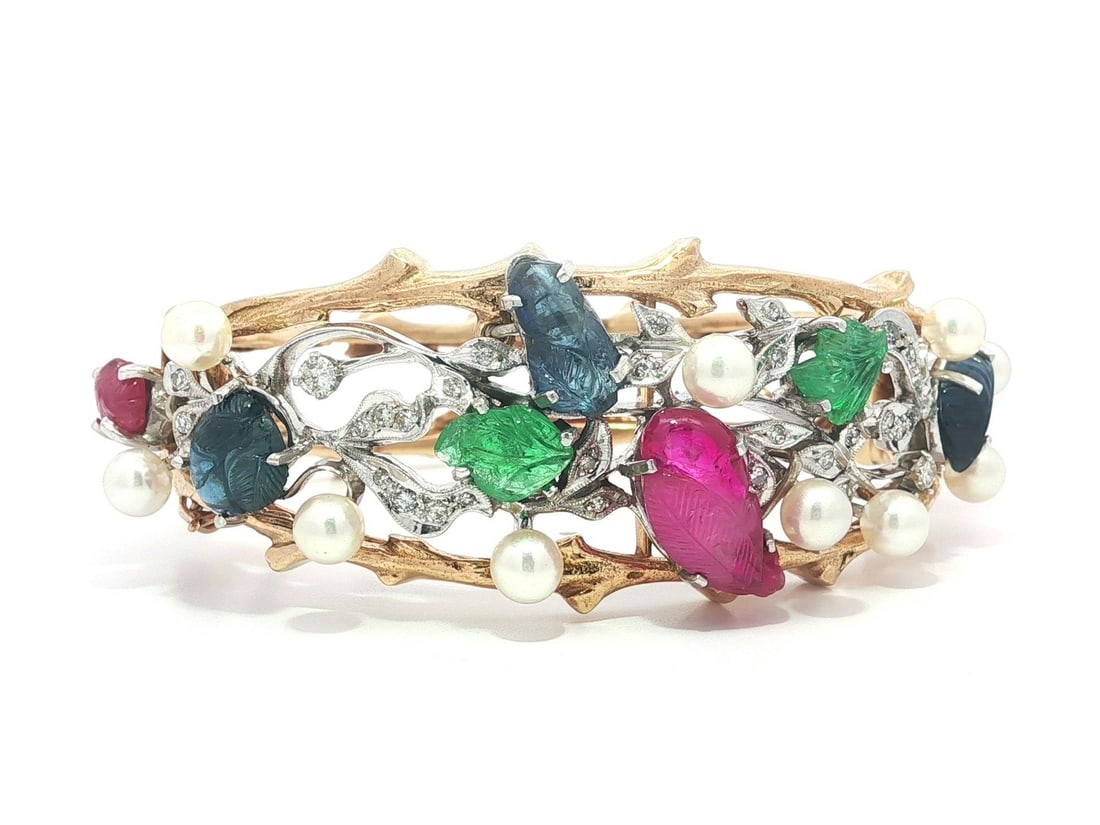 Bangle Bracelet in Yellow Gold Platinum with GIA Sapphire Ruby Emerald Pearl Diamond: Bangle Bracelet in Yellow Gold Platinum with GIA Sapphire Ruby Emerald Pearl Diamond This vintage bangle bracelet features an exquisite Tutti Frutti design crafted from solid 14k yellow gold with whit