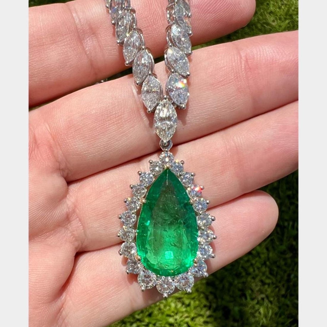 Stunning Platinum Emerald 14.12 Ct Diamond Pendant and 34.08 Ct Necklace: Stunning Platinum Emerald 14.12 Ct Diamond Pendant and 34.08 Ct Necklace This exquisite jewelry set features a stunning platinum pendant and a graduated diamond necklace. The pendant showcases a capti
