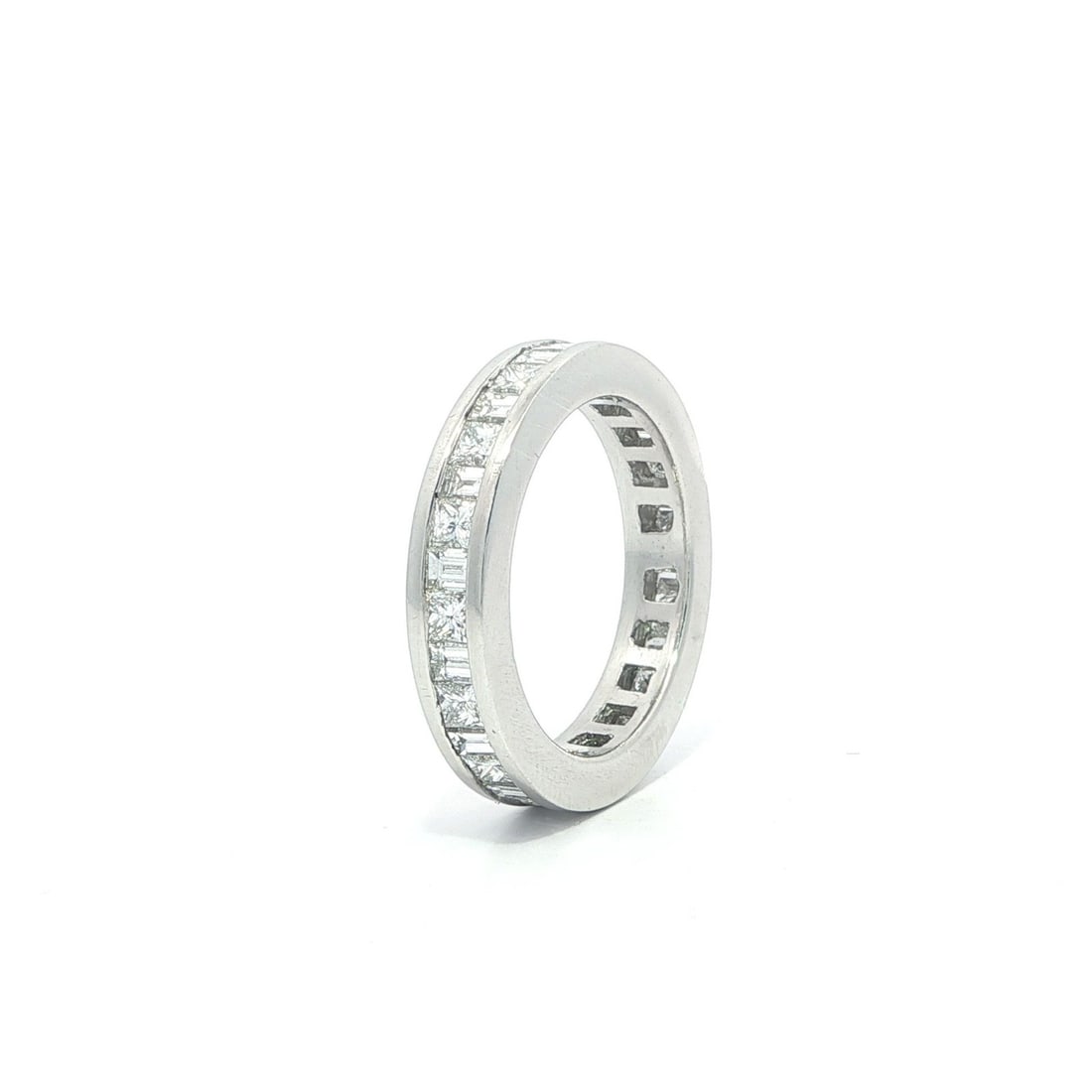 Platinum 1.50ctw Baguette Princess Cut Diamond Eternity Band Ring: Platinum 1.50ctw Baguette Princess Cut Diamond Eternity Band Ring Exquisite Platinum Eternity Band Ring featuring a stunning arrangement of 32 natural diamonds meticulously set in a channel design. Th