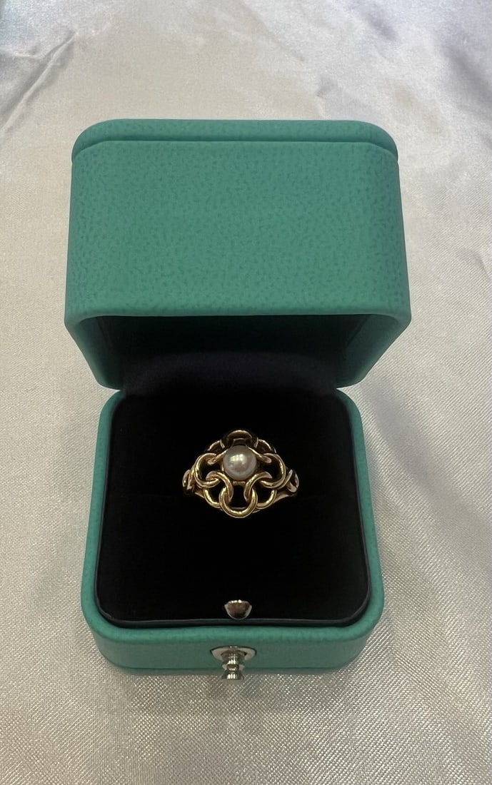 Tiffany & Co Pearl Ring 14k Yellow Gold Size 5.25 With Box: Tiffany & Co Pearl Ring 14k Yellow Gold Size 5.25 With Box This Tiffany & Co. ring features a lustrous pearl set in 14k yellow gold. Sized at 5.25, the ring is crafted in the United States and comes w