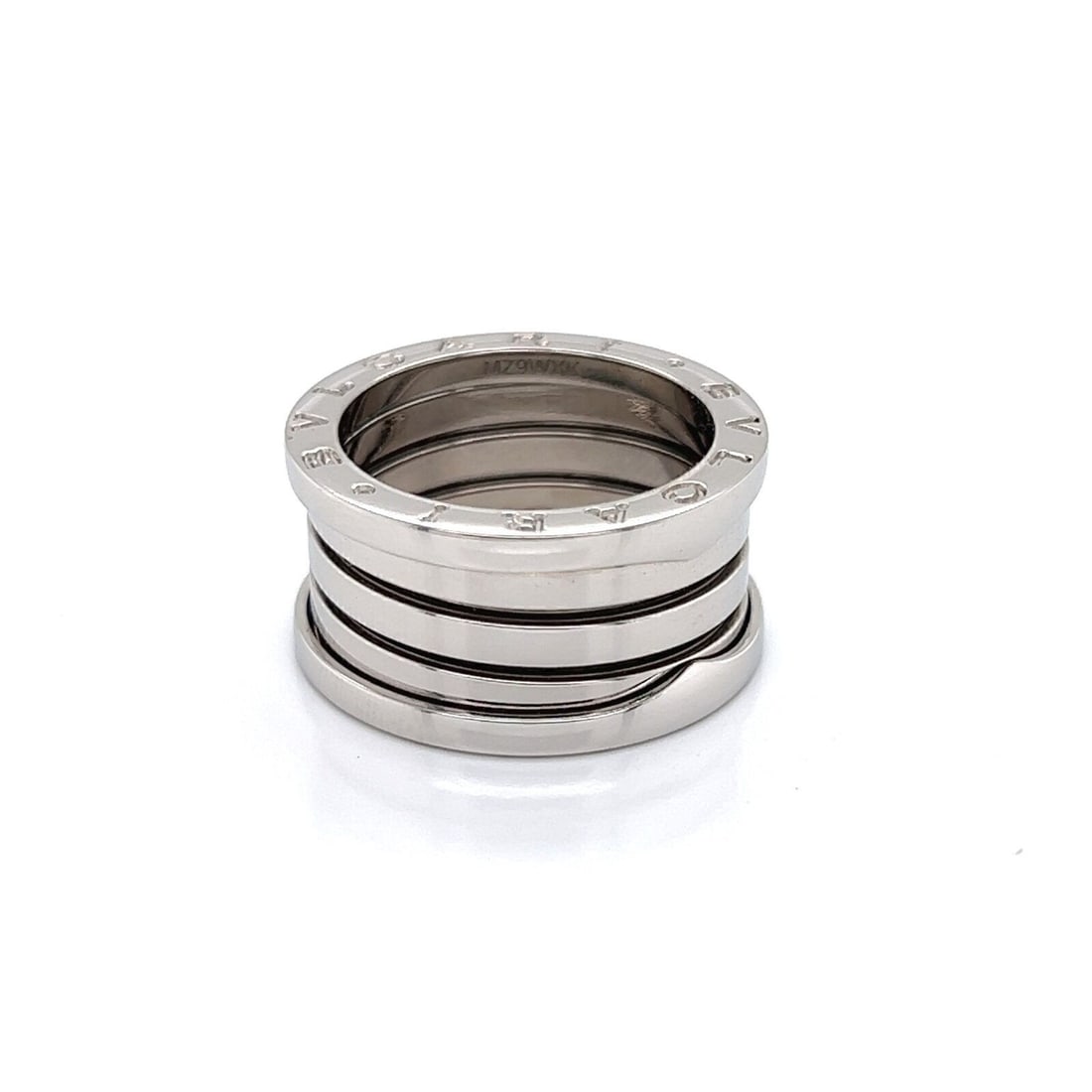 Bvlgari B.zero1 18k White Gold Four Band Ring Size 6.5 with Certificate: Bvlgari B.zero1 18k White Gold Four Band Ring Size 6.5 with Certificate This authentic Bvlgari B.zero1 ring is crafted in 18k white gold and features the iconic four-band spiral design. It is a fine j