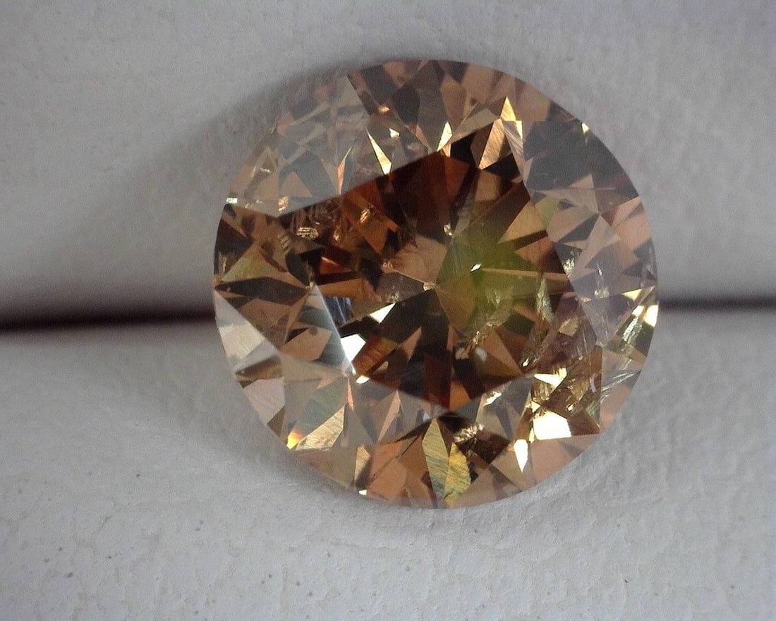 Loose Diamond - ROUND 1.51ct Brown SI2: Loose Diamond - ROUND 1.51ct Brown SI2 Source: Natural Shape: ROUND Carats: 1.51 Color: Brown Certification: OTHER The Diamond Depot Guarantee: All items in this auction are guaranteed to be 100% auth