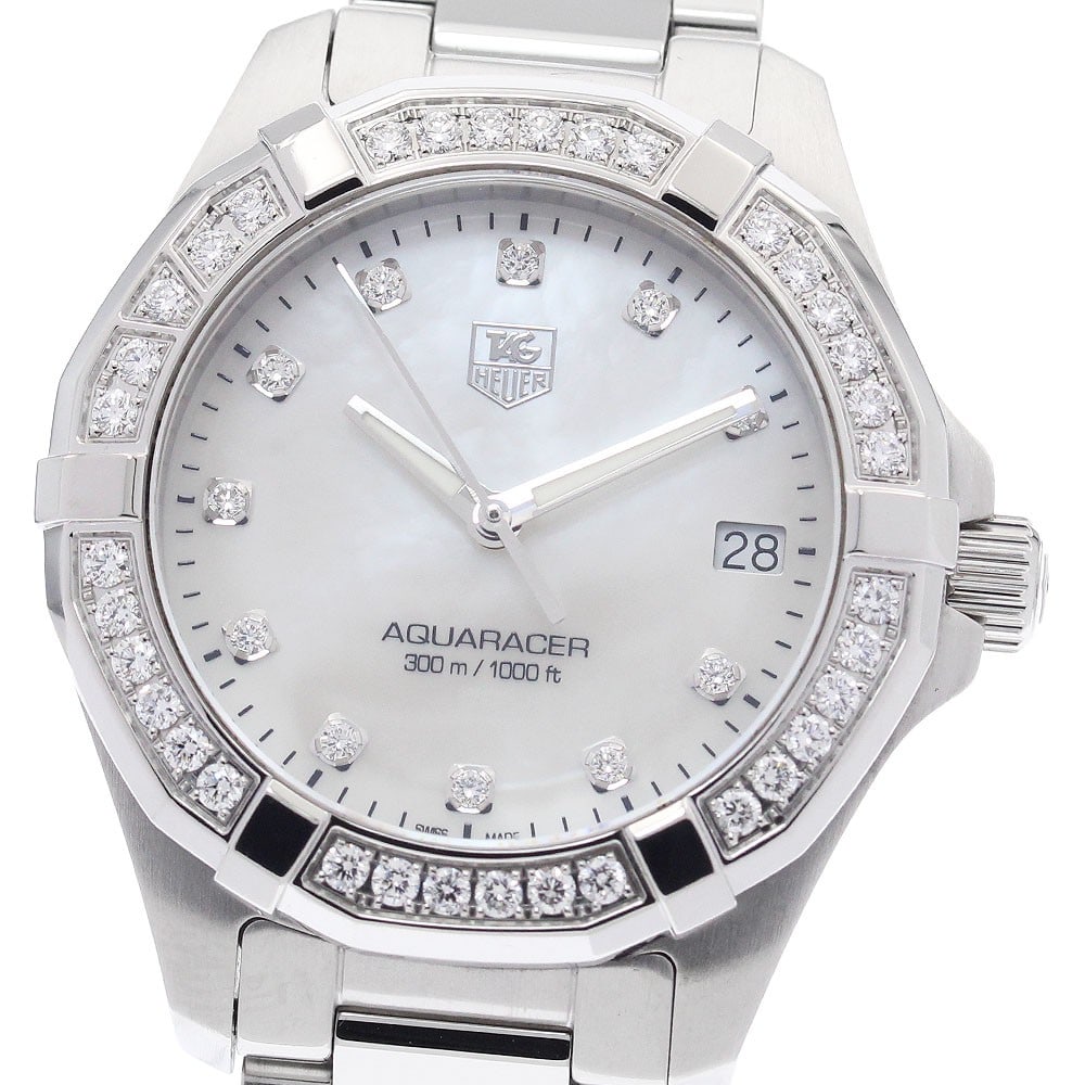 TAG HEUER Way1314 Aquaracer women's quartz wristwatch with 11-diamond bezel: TAG HEUER Way1314 Aquaracer women's quartz wristwatch with 11-diamond bezel TAG Heuer Aquaracer quartz women's wristwatch with an 11-diamond bezel. This pre-owned watch is of Swiss origin and is ident