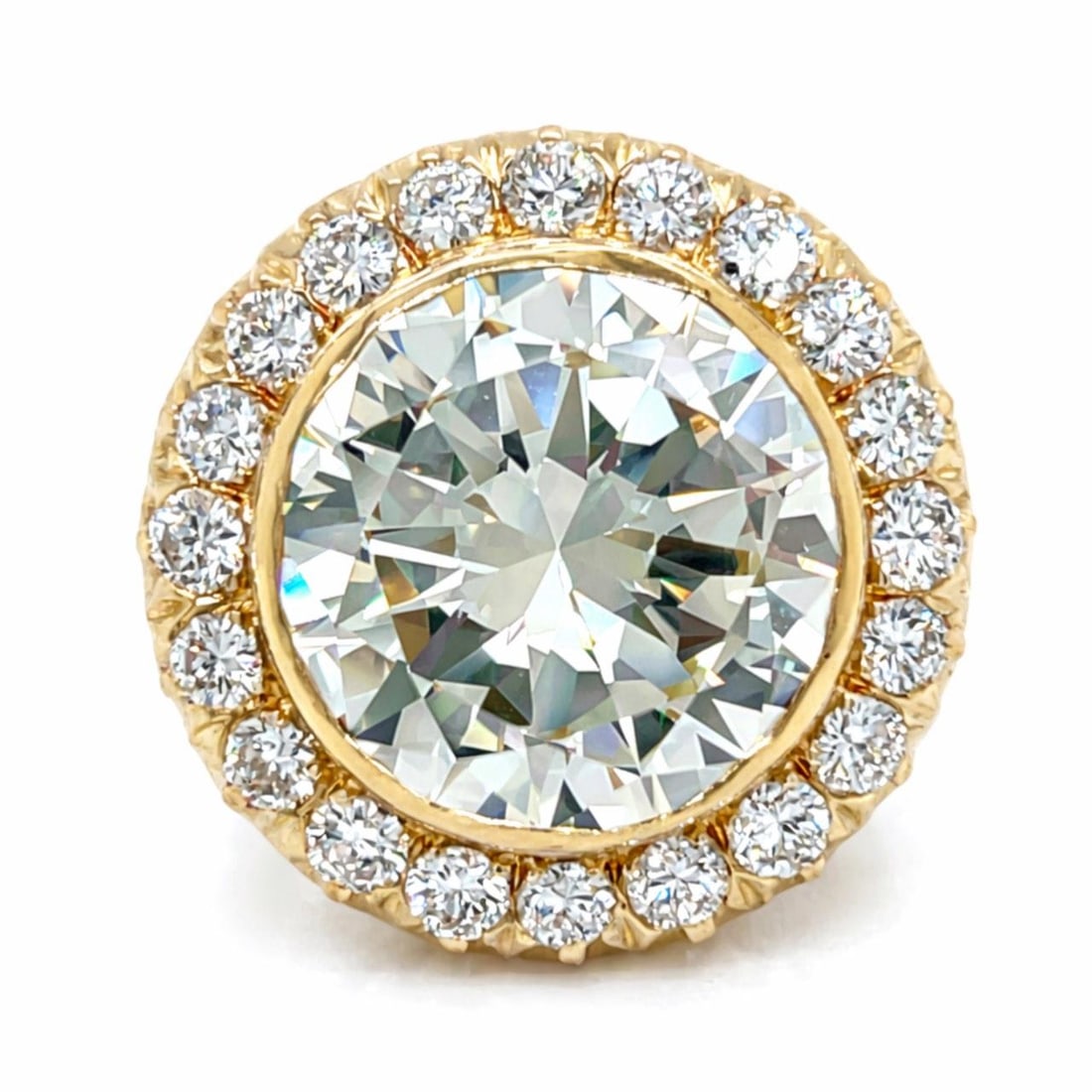 GIA 10.01 Carat N SI1 Diamond Ring in 18K Yellow Gold with Side Stones: GIA 10.01 Carat N SI1 Diamond Ring in 18K Yellow Gold with Side Stones This 18K yellow gold ring features a GIA certified 10.01 carat round diamond with N color and SI1 clarity, measuring approximatel