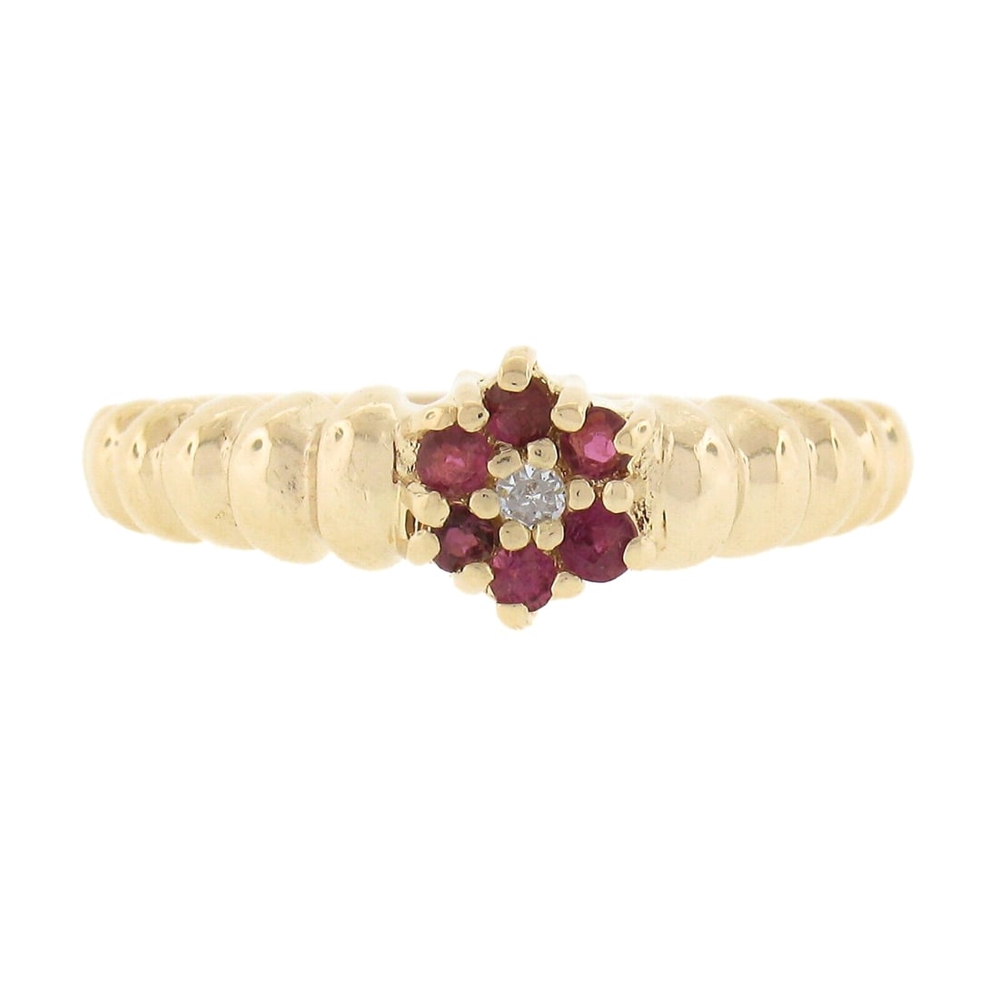 14k Yellow Gold Floral Ruby Diamond Halo Cluster Ring 0.14ctw: 14k Yellow Gold Floral Ruby Diamond Halo Cluster Ring 0.14ctw This exquisite 14k Yellow Gold ring features a stunning floral design, showcasing a cluster of six round brilliant cut rubies surrounded b