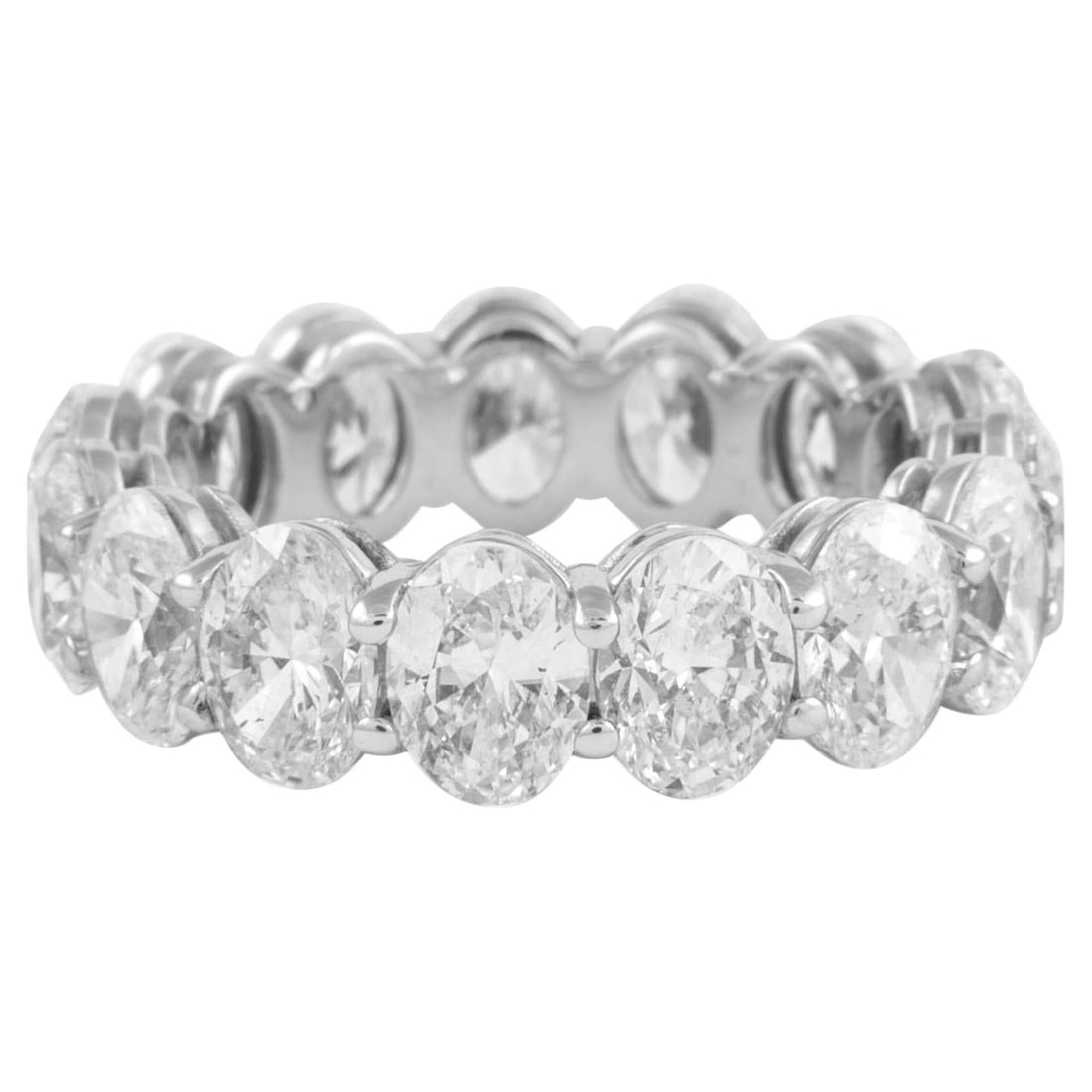 7.34ct Oval Cut Diamond Eternity Band 18k White Gold: 7.34ct Oval Cut Diamond Eternity Band 18k White Gold This stunning eternity band features 15 exquisite oval cut diamonds totaling 7.34 carats, set in luxurious 18k white gold. The diamonds exhibit