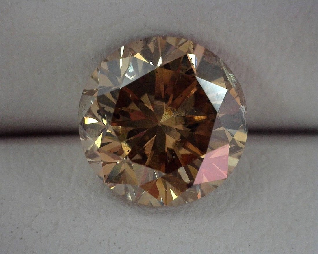 Loose Diamond - ROUND 1.22ct Brown I1: Loose Diamond - ROUND 1.22ct Brown I1 Source: Natural Shape: ROUND Carats: 1.22 Color: Brown Certification: OTHER The Diamond Depot Guarantee: All items in this auction are guaranteed to be 100% authe