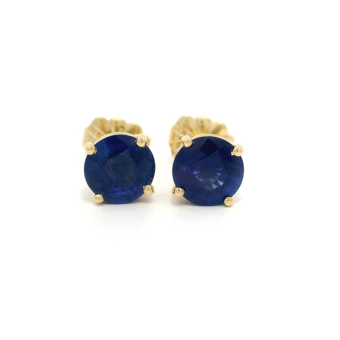 14k Yellow Gold 1.71ctw Royal Blue Sapphire Stud Earrings: 14k Yellow Gold 1.71ctw Royal Blue Sapphire Stud Earrings Enhance your jewelry collection with these exquisite stud earrings, featuring two natural genuine sapphires, each approximately 6mm in size. T