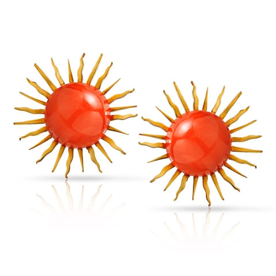 1970s 18K Yellow Gold Sunburst Orange Coral Clip-On Earrings: 1970s 18K Yellow Gold Sunburst Orange Coral Clip-On Earrings These stunning clip-on earrings showcase a vibrant cabochon cut orange coral set within a dazzling sunburst design, crafted from luxurious 