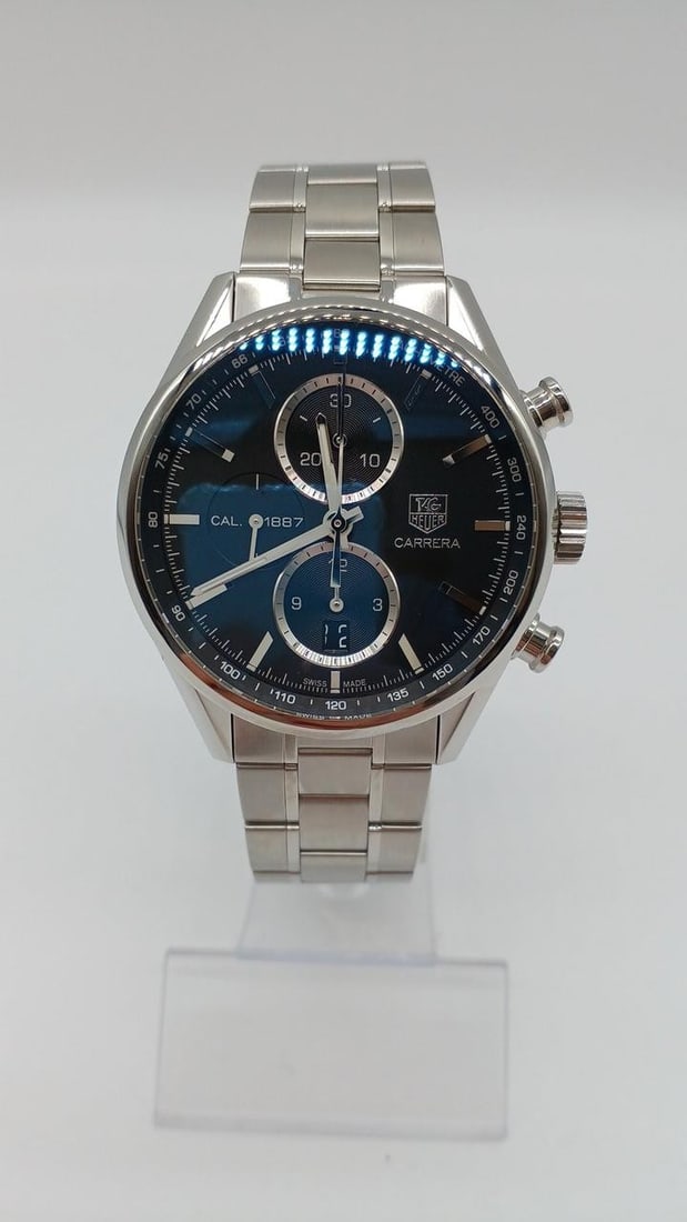 TAG Heuer CAR2110.BA0720 Carrera Caliber 1887 Chronograph Wristwatch: TAG Heuer CAR2110.BA0720 Carrera Caliber 1887 Chronograph Wristwatch TAG Heuer Carrera Chronograph Caliber 1887 men's wristwatch. This pre-owned Swiss-made watch is identified as a Carrera Chronograph