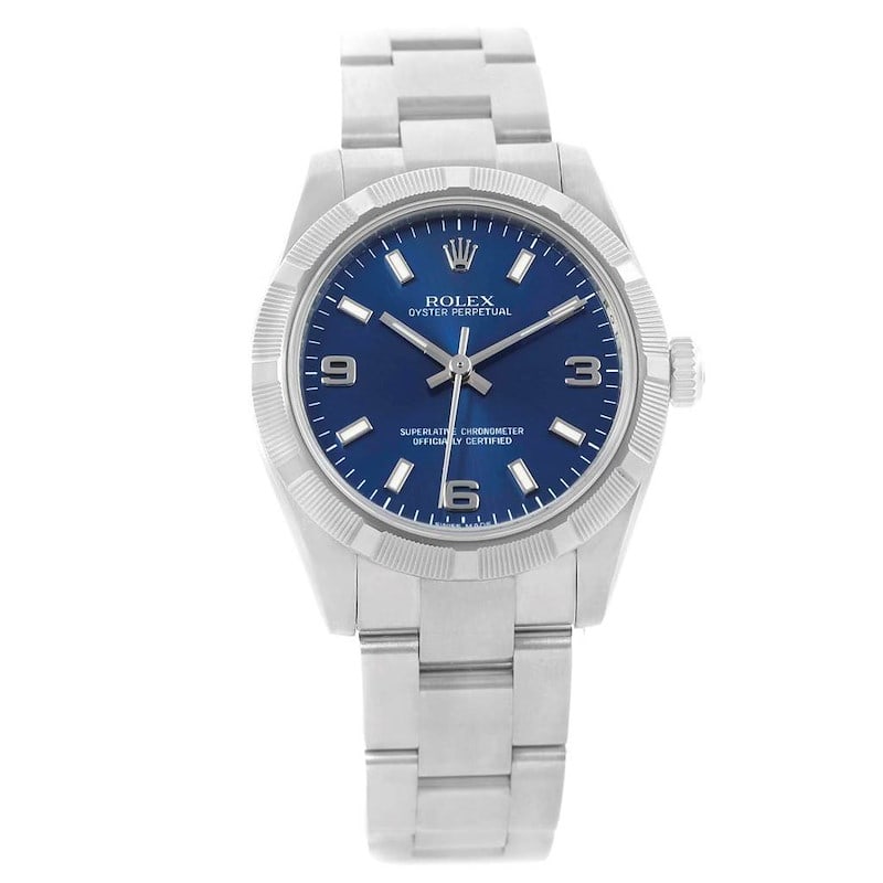 Ladies Rolex 177210 Oyster Perpetual Engine Turned Bezel Blue Dial Watch: Ladies Rolex 177210 Oyster Perpetual Engine Turned Bezel Blue Dial Watch This Rolex Oyster Perpetual features a blue dial and an engine-turned bezel, complemented by the classic Oyster bracelet. Desig