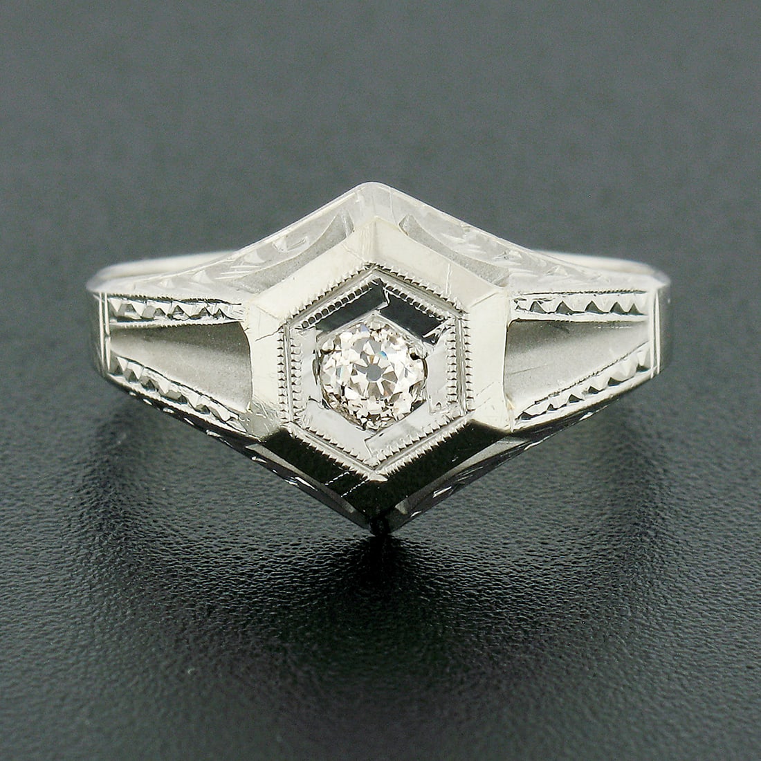 Vintage 18k White Gold Diamond Solitaire Hand Engraved Hexagon Ring: Vintage 18k White Gold Diamond Solitaire Hand Engraved Hexagon Ring This exquisite vintage ring is crafted from solid 18k white gold, showcasing a stunning hexagonal design. At its center lies a natur