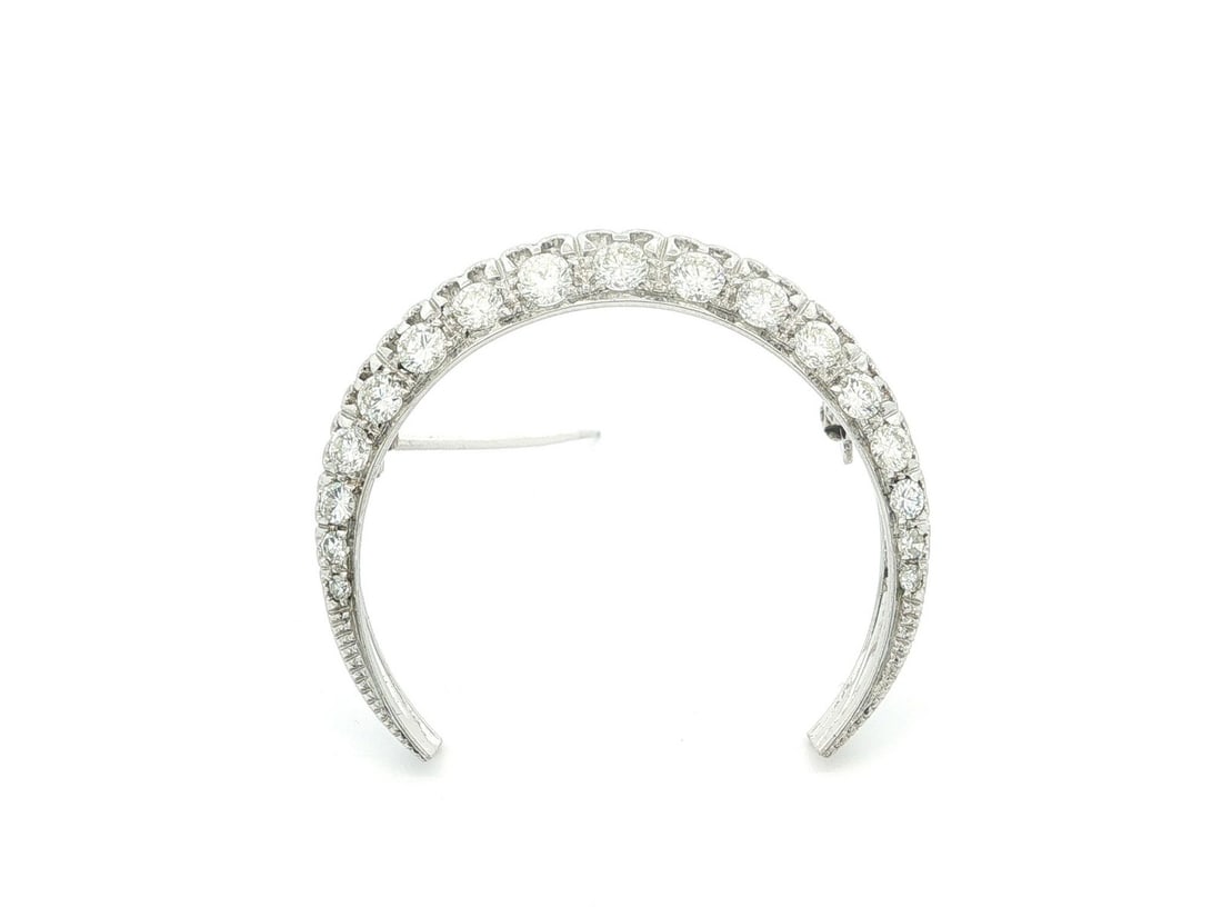 Crescent Diamond Brooch in 18k White Gold 1.25ctw: Crescent Diamond Brooch in 18k White Gold 1.25ctw Vintage crescent pin brooch crafted in solid 18k white gold and set with natural diamonds. This pre-owned piece features 17 single and round brilliant