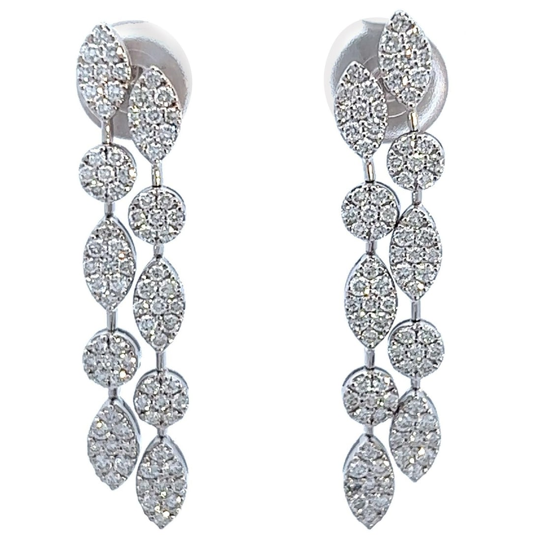1.12ct Diamond Dangle Earrings in 18k White Gold Falling Leaves Design: 1.12ct Diamond Dangle Earrings in 18k White Gold Falling Leaves Design Introducing a stunning pair of dangle earrings featuring a graceful falling leaves motif, crafted in luxurious 18k white gold. Th