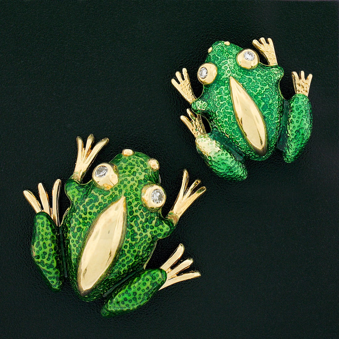 Pair of 18k Gold Textured Green Enamel Frog Diamond Brooches: Pair of 18k Gold Textured Green Enamel Frog Diamond Brooches This exquisite pair of brooches showcases a charming mother and baby frog design, meticulously crafted from solid 18k yellow gold. Each fro
