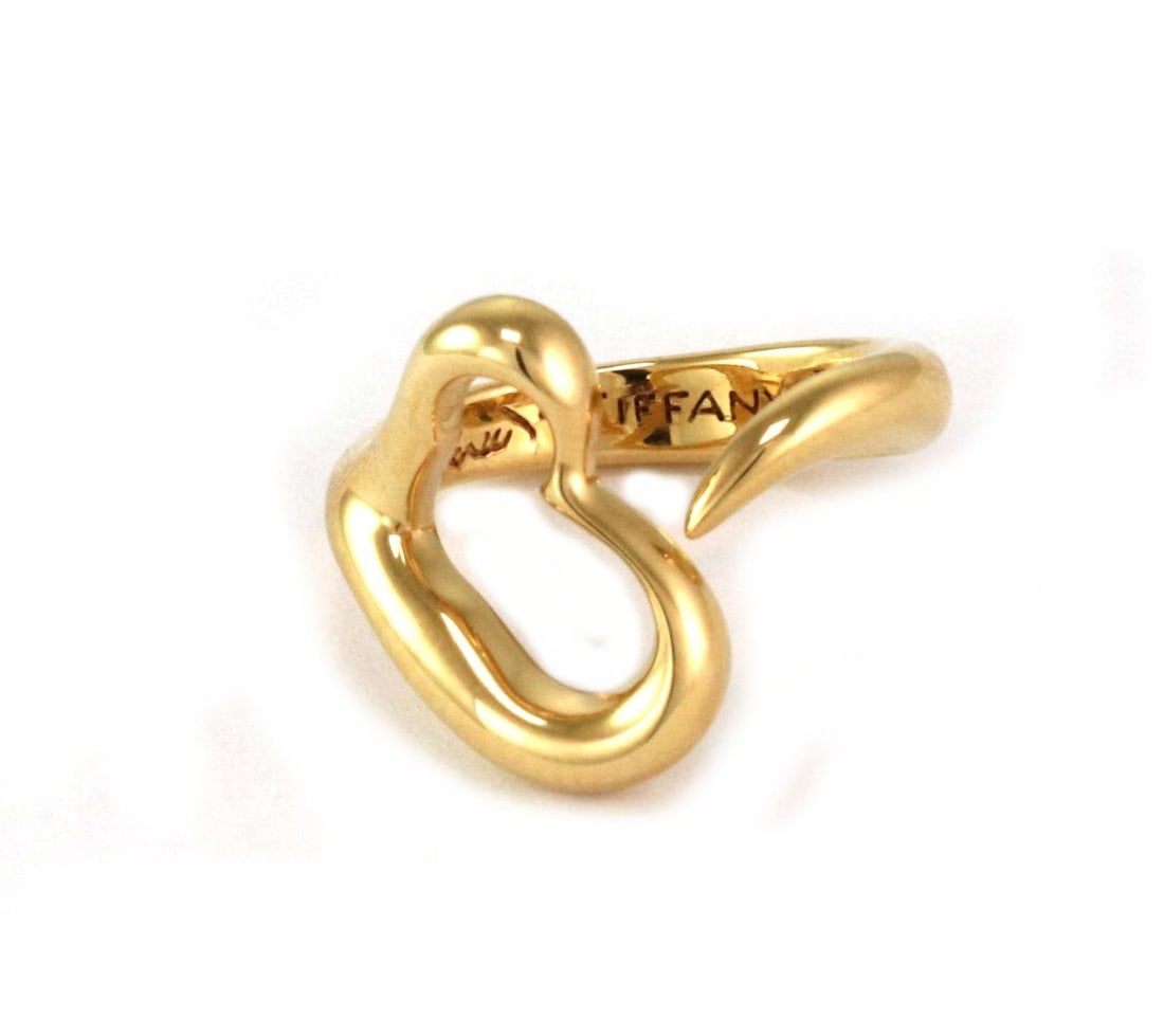 Tiffany & Co. Elsa Peretti Open Heart Ring 18k Yellow Gold: Tiffany & Co. Elsa Peretti Open Heart Ring 18k Yellow Gold This elegant ring from Tiffany & Co. is designed by Elsa Peretti and belongs to the iconic Open Heart collection. Crafted from luxurious 18k 