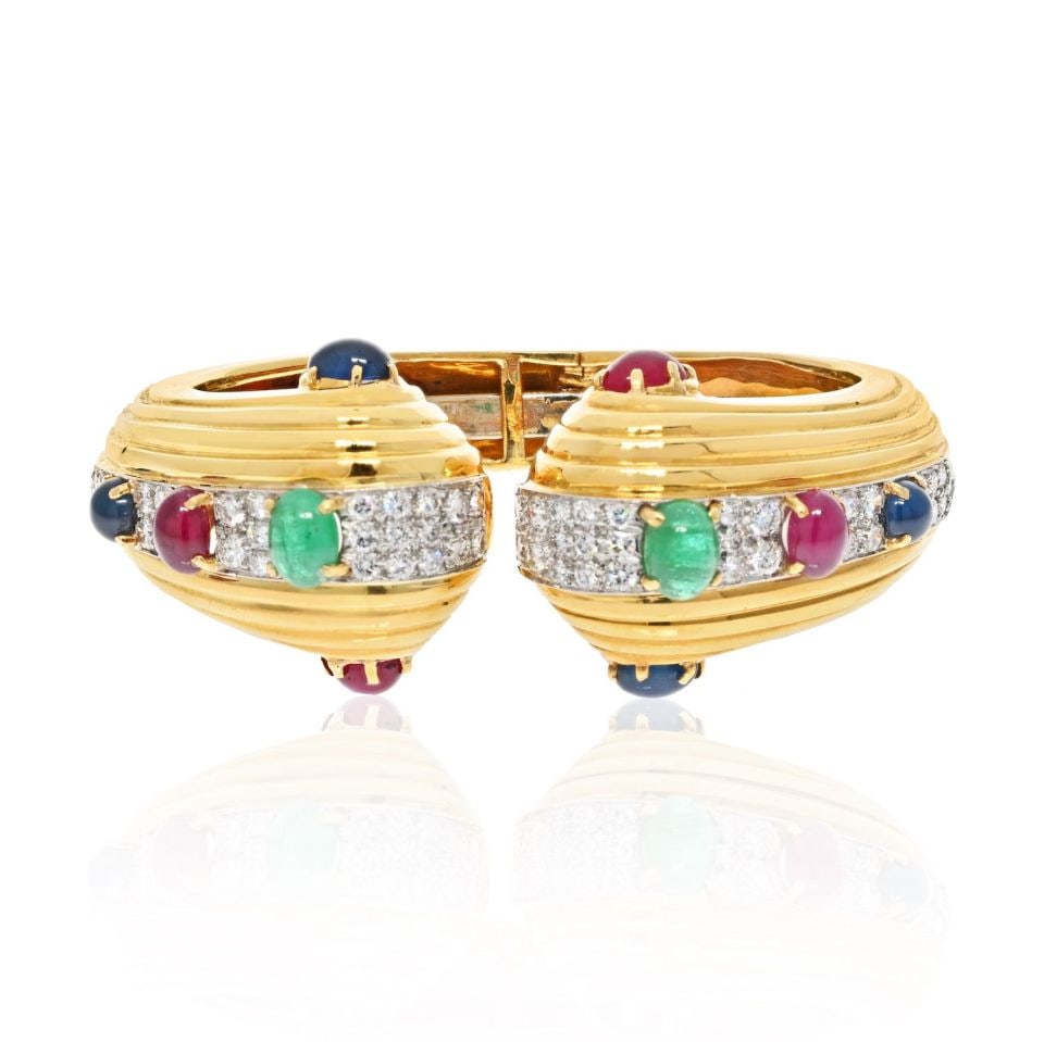 David Webb 18K Yellow Gold Hinged Bracelet with Gemstones: David Webb 18K Yellow Gold Hinged Bracelet with Gemstones Exquisite David Webb bracelet crafted in luxurious 18K yellow gold. This hinged bracelet features a stunning array of oval cabochon cut gemsto
