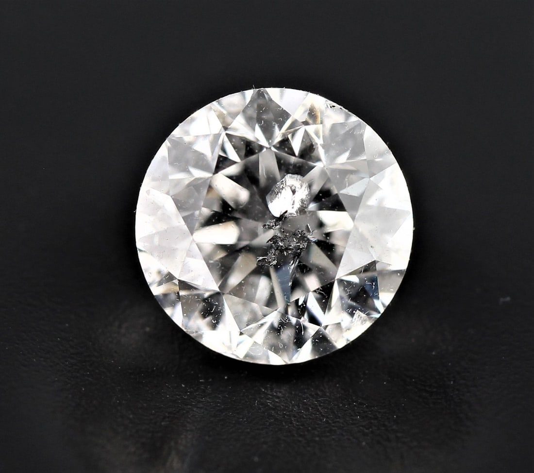 Loose Diamond - ROUND 0.7ct E I1: Loose Diamond - ROUND 0.7ct E I1 Source: Natural Shape: ROUND Carats: 0.7 Color: E Clarity: I1 Certification: NONE The Diamond Depot Guarantee: All items in this auction are guaranteed to be 100% auth