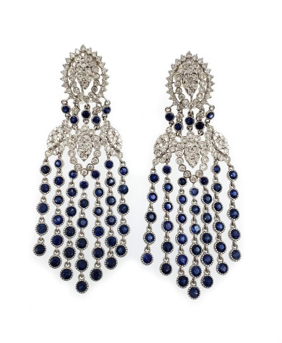 Estate 18k White Gold Diamond Sapphire Chandelier Earrings: Estate 18k White Gold Diamond Sapphire Chandelier Earrings Exquisite Estate Diamond Sapphire Chandelier Earrings crafted in luxurious 18k white gold. These stunning earrings feature an eye-shaped desi
