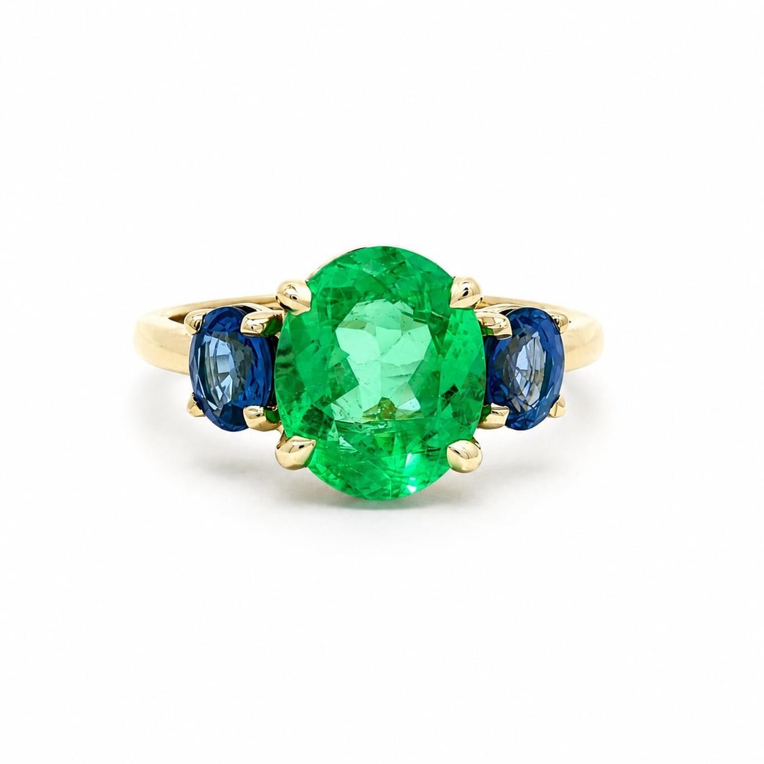 GIA Certified Colombian Emerald and Sapphire 3.66ctw Three Stone 18k Yellow Gold Ring: GIA Certified Colombian Emerald and Sapphire 3.66ctw Three Stone 18k Yellow Gold Ring This un-used custom ring features a natural Colombian emerald as the centerpiece, certified by GIA and weighing 2.