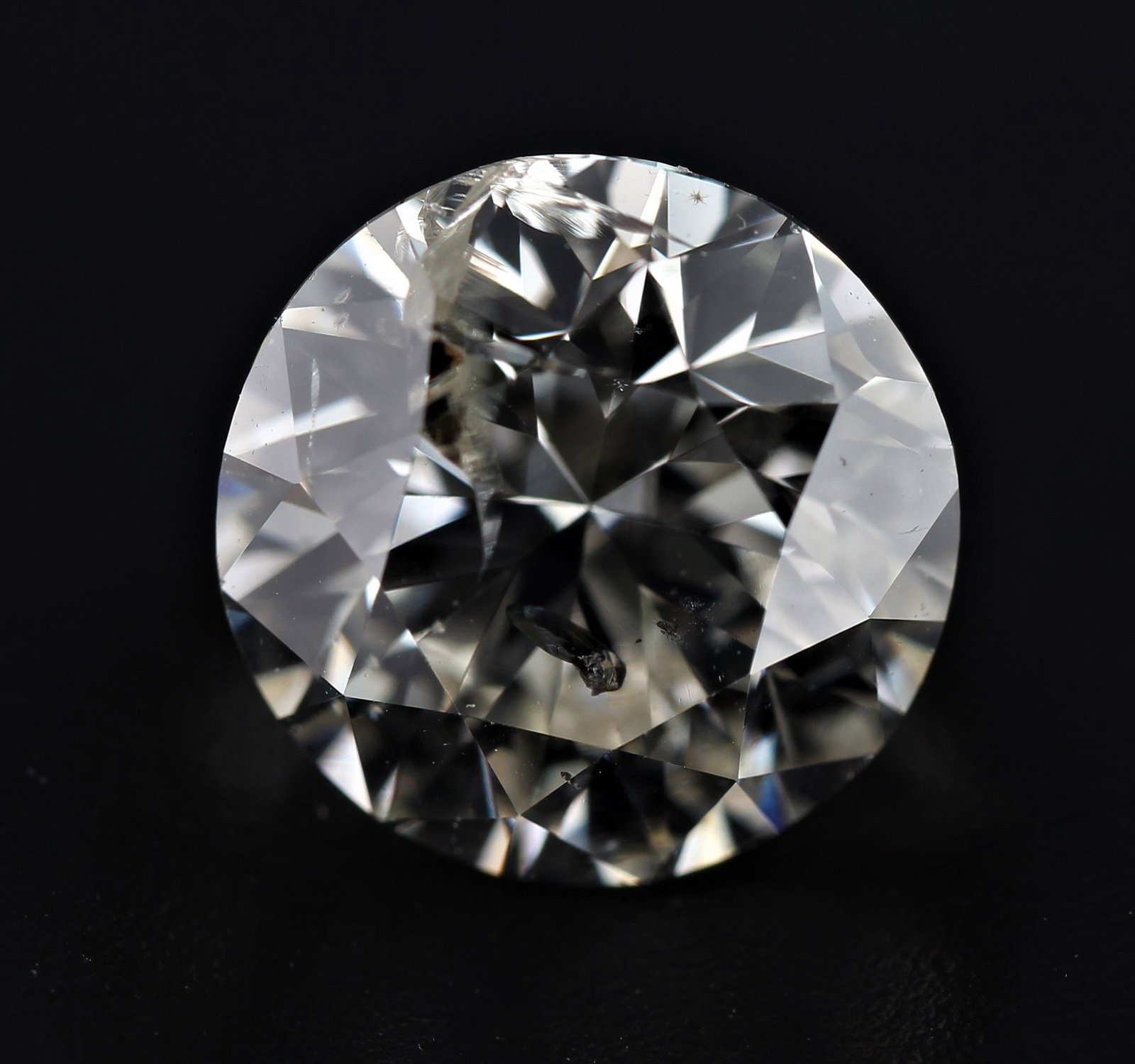 Loose Diamond - ROUND 1.24ct J I2: Loose Diamond - ROUND 1.24ct J I2 Source: Natural Shape: ROUND Carats: 1.24 Color: J Clarity: I2 Certification: NONE The Diamond Depot Guarantee: All items in this auction are guaranteed to be 100% au