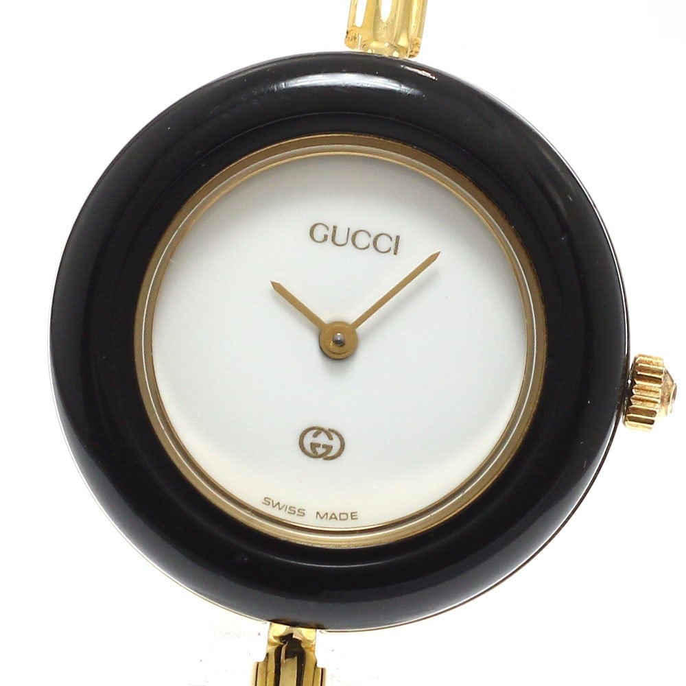 Gucci Change Bezel Quartz Ladies Watch 11 12 with Inner Box: Gucci Change Bezel Quartz Ladies Watch 11 12 with Inner Box This Gucci 11/12 Changeable Bezel Quartz women's wristwatch features a stainless steel and gold-plated case and bracelet, complemented by a 