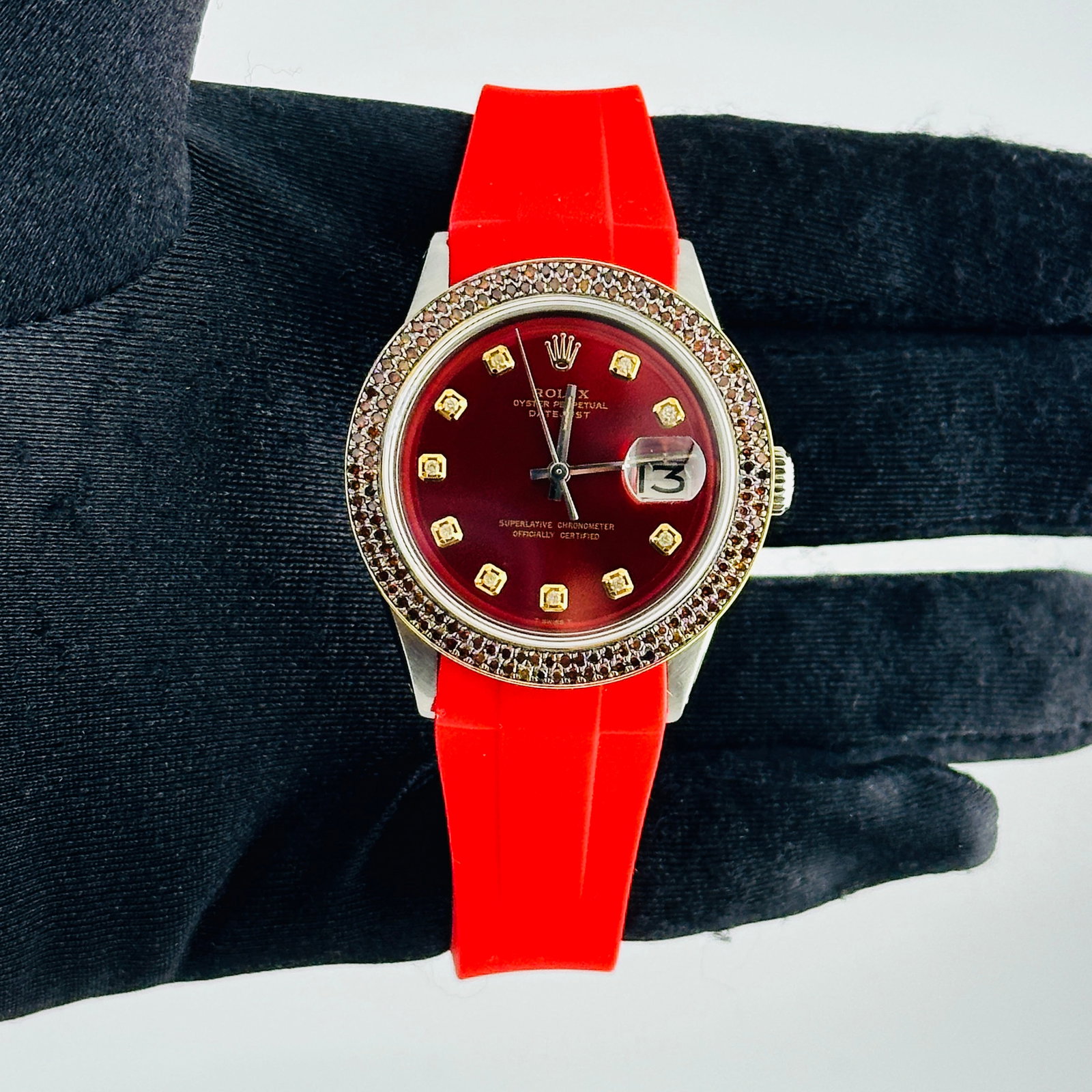 Rolex Datejust Mens Watch Aftermarket Red Yellow Diamond Dial Rubber Band Ref 1603: Rolex Datejust Mens Watch Aftermarket Red Yellow Diamond Dial Rubber Band Ref 1603 This Rolex Datejust features an aftermarket red and yellow diamond dial, complemented by a pave plated bezel with two
