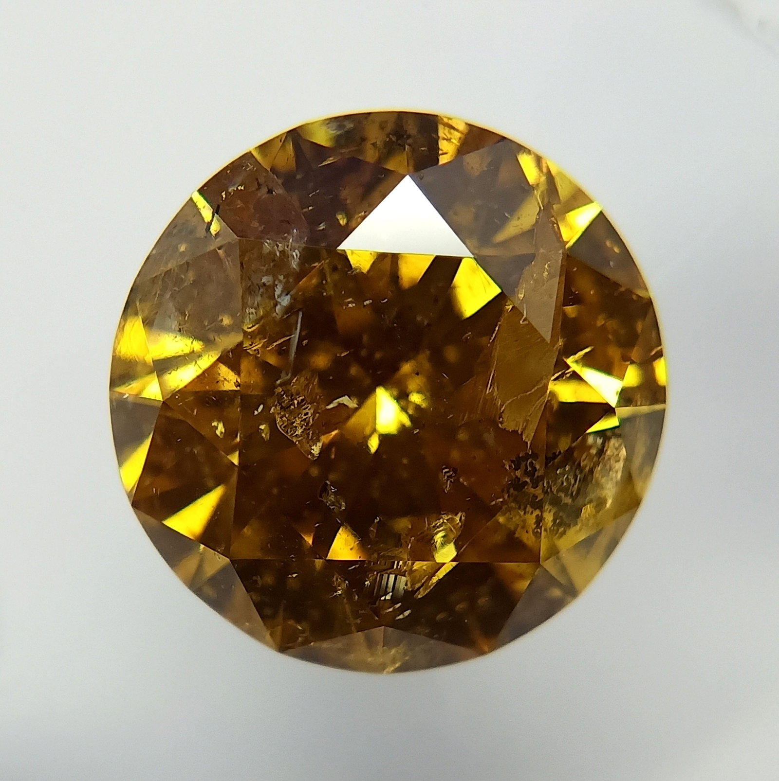Loose Diamond - ROUND 2.0ct Fancy Deep Yellow Brown: Loose Diamond - ROUND 2.0ct Fancy Deep Yellow Brown Source: Natural Shape: ROUND Carats: 2.0 Color: Fancy Deep Yellow Brown Certification: GIA The Diamond Depot Guarantee: All items in this auction ar